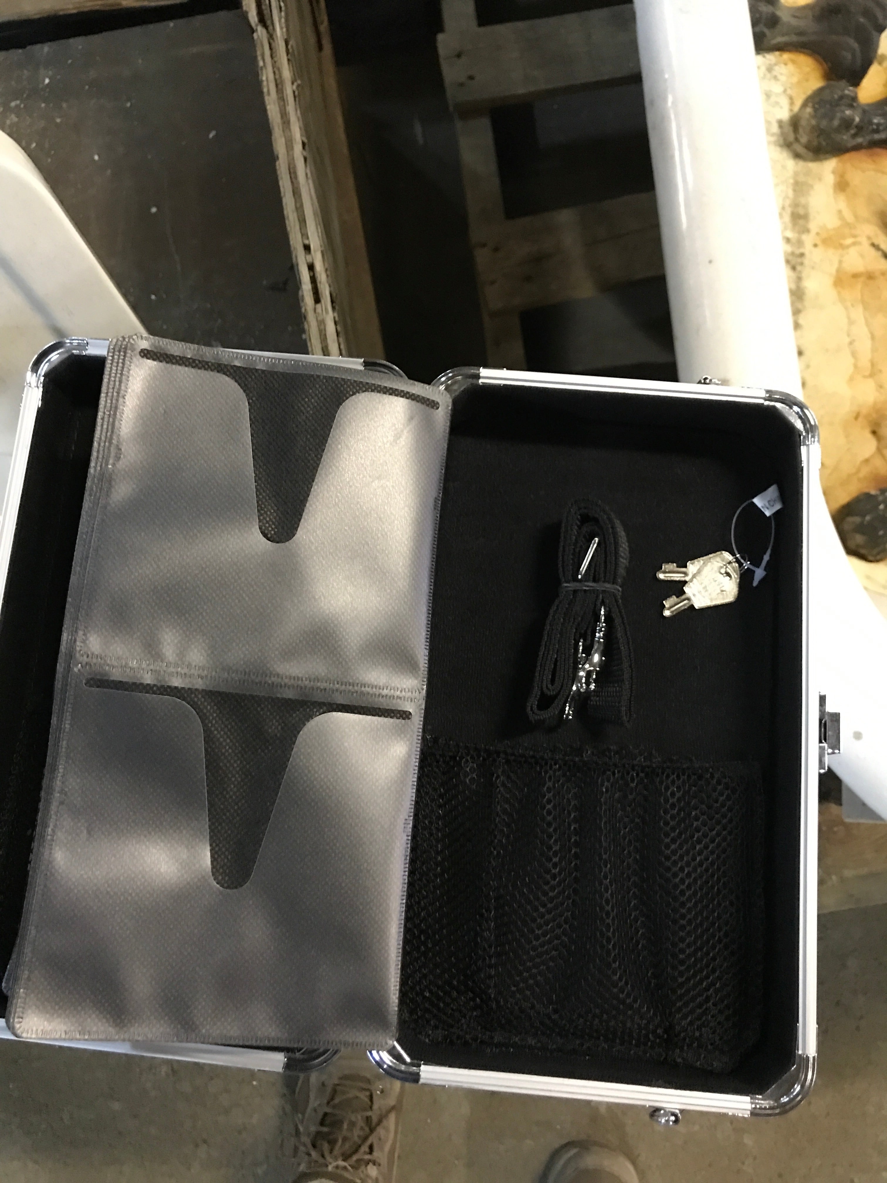 CD case with key and shoulder strap