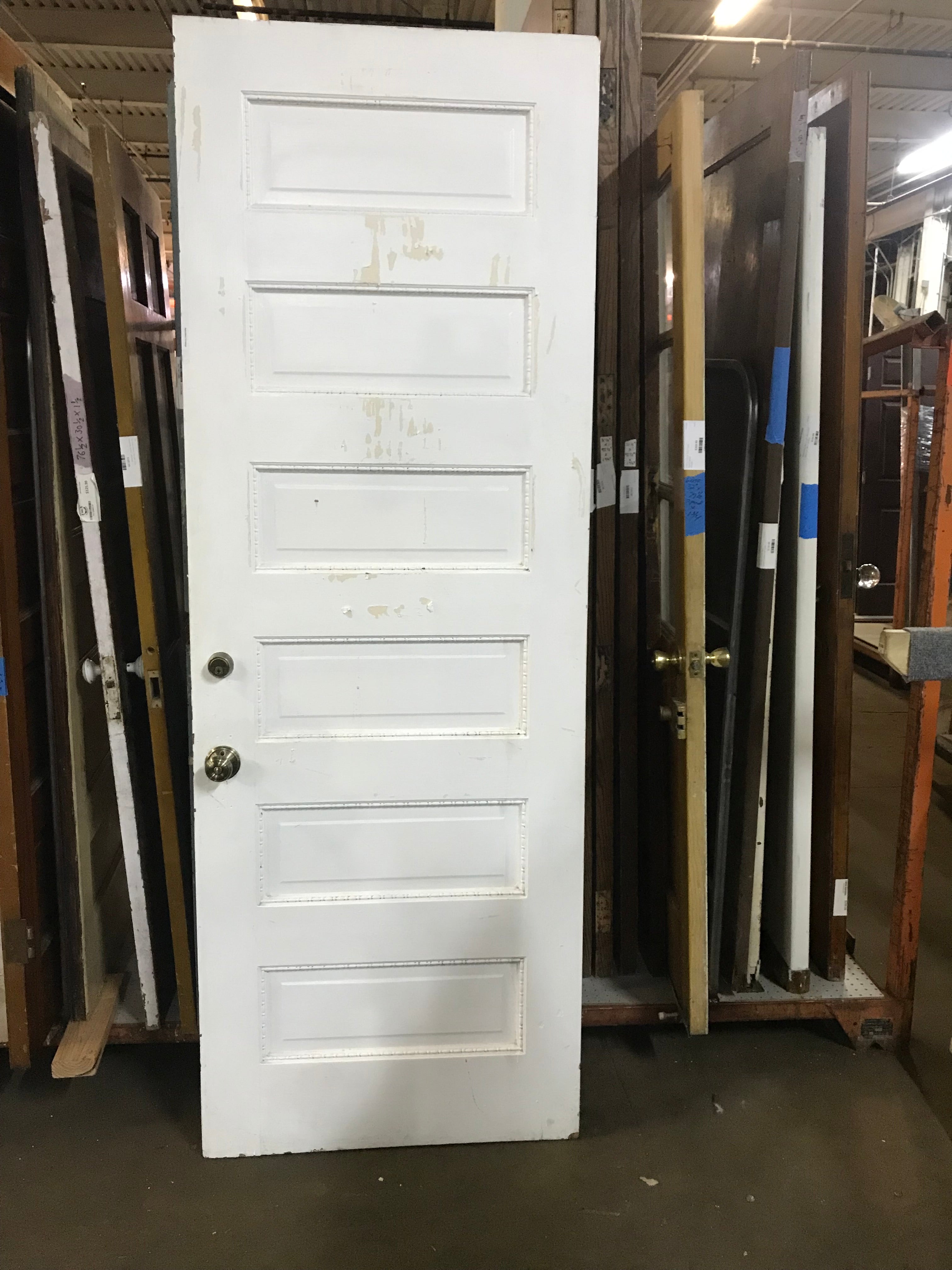 Six Panel Wood Door with decorative trim around panels