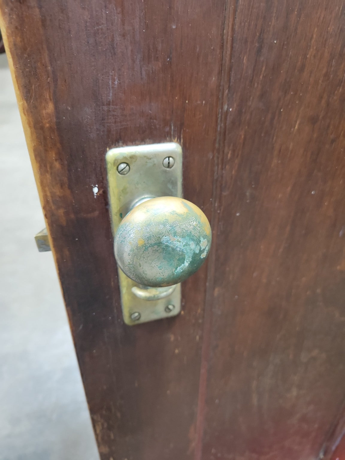 Antique Two-Panel Interior Door with Brass and Glass Knob Set