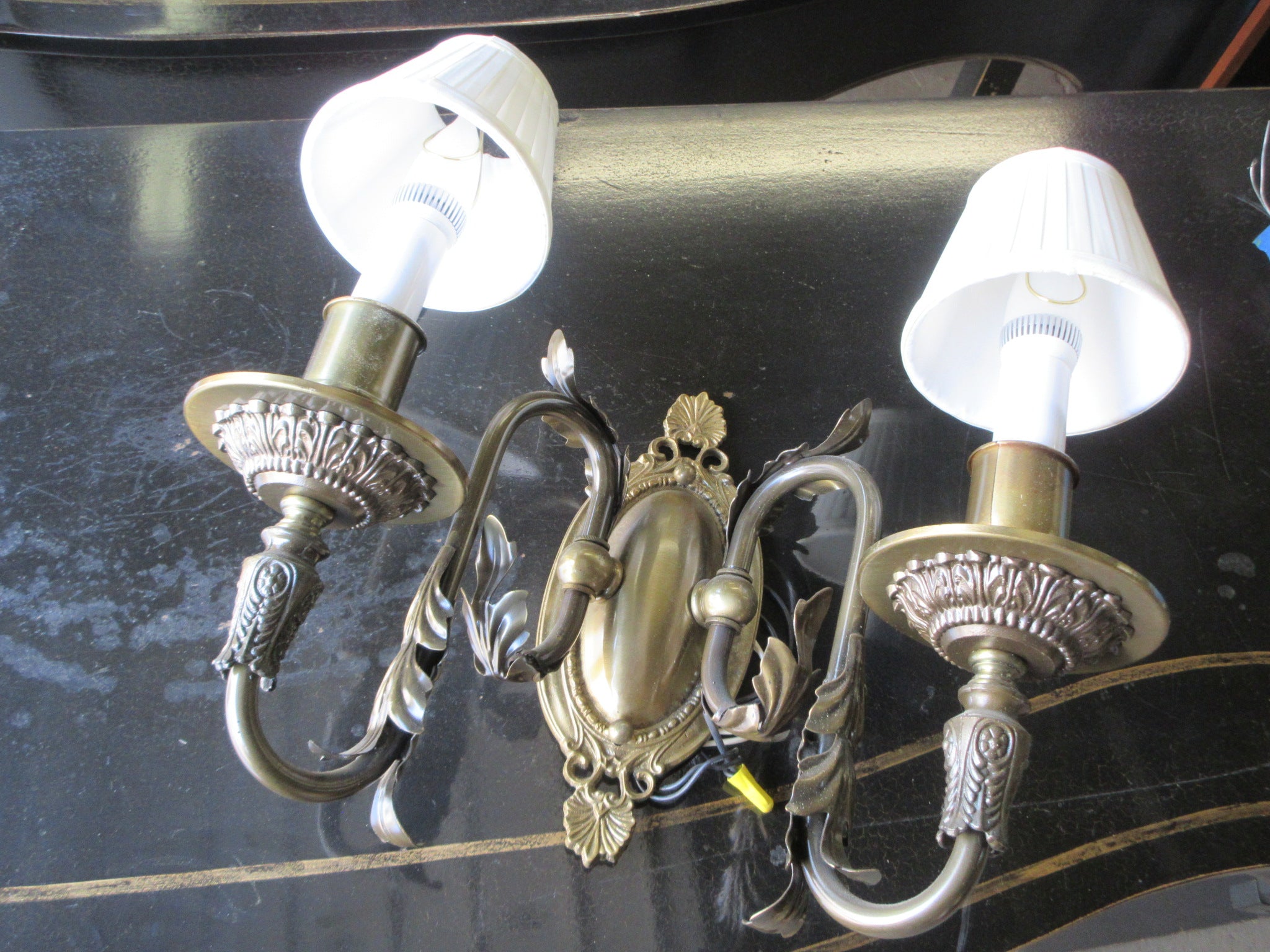 Two Light Wall Sconce with Leaf Embellishment