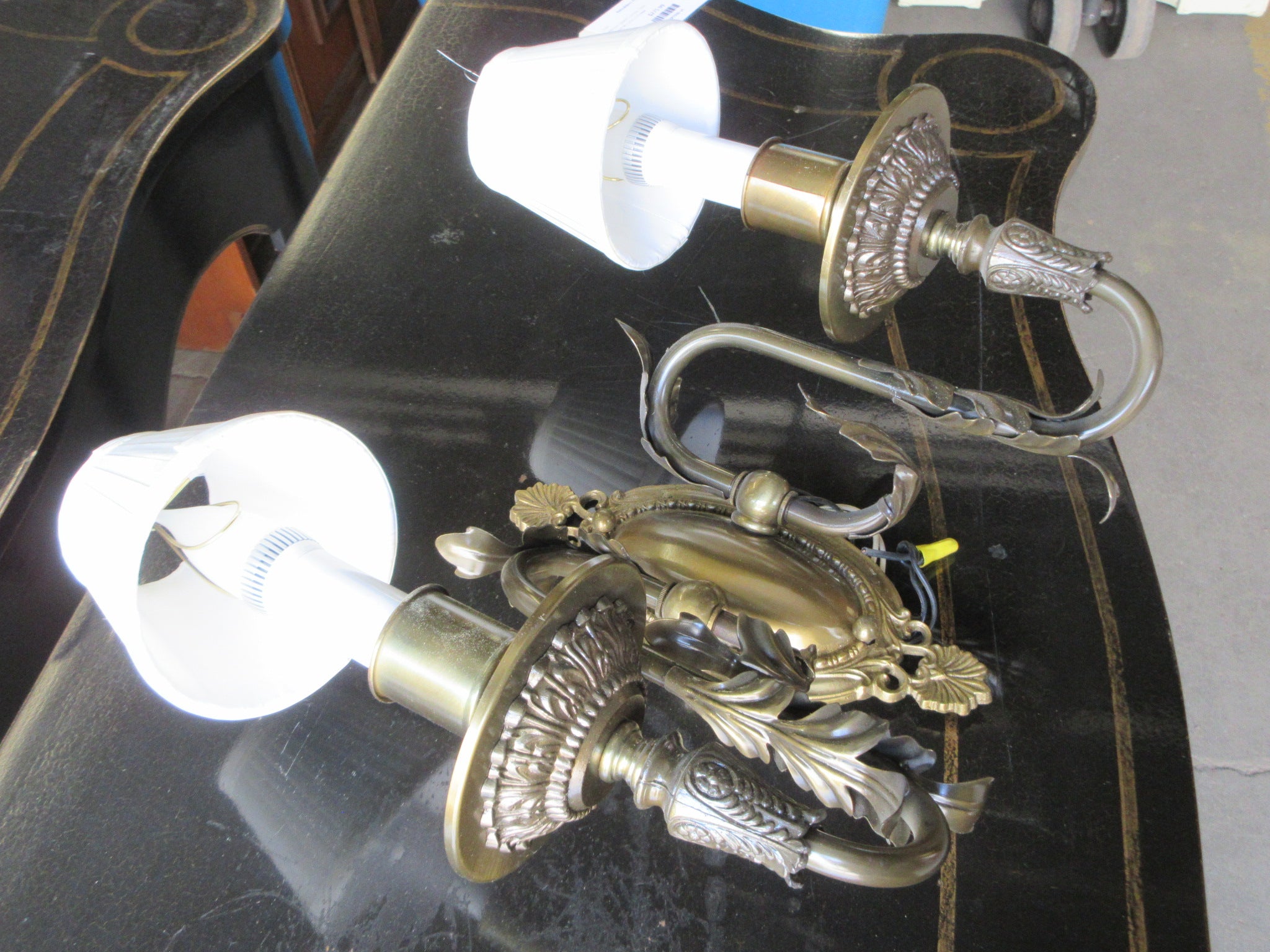 Two Light Wall Sconce with Leaf Embellishment