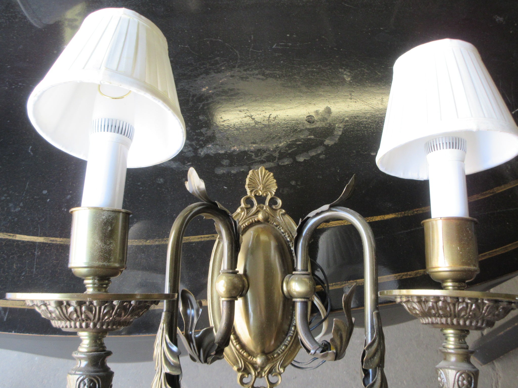 Two Light Wall Sconce with Leaf Embellishment