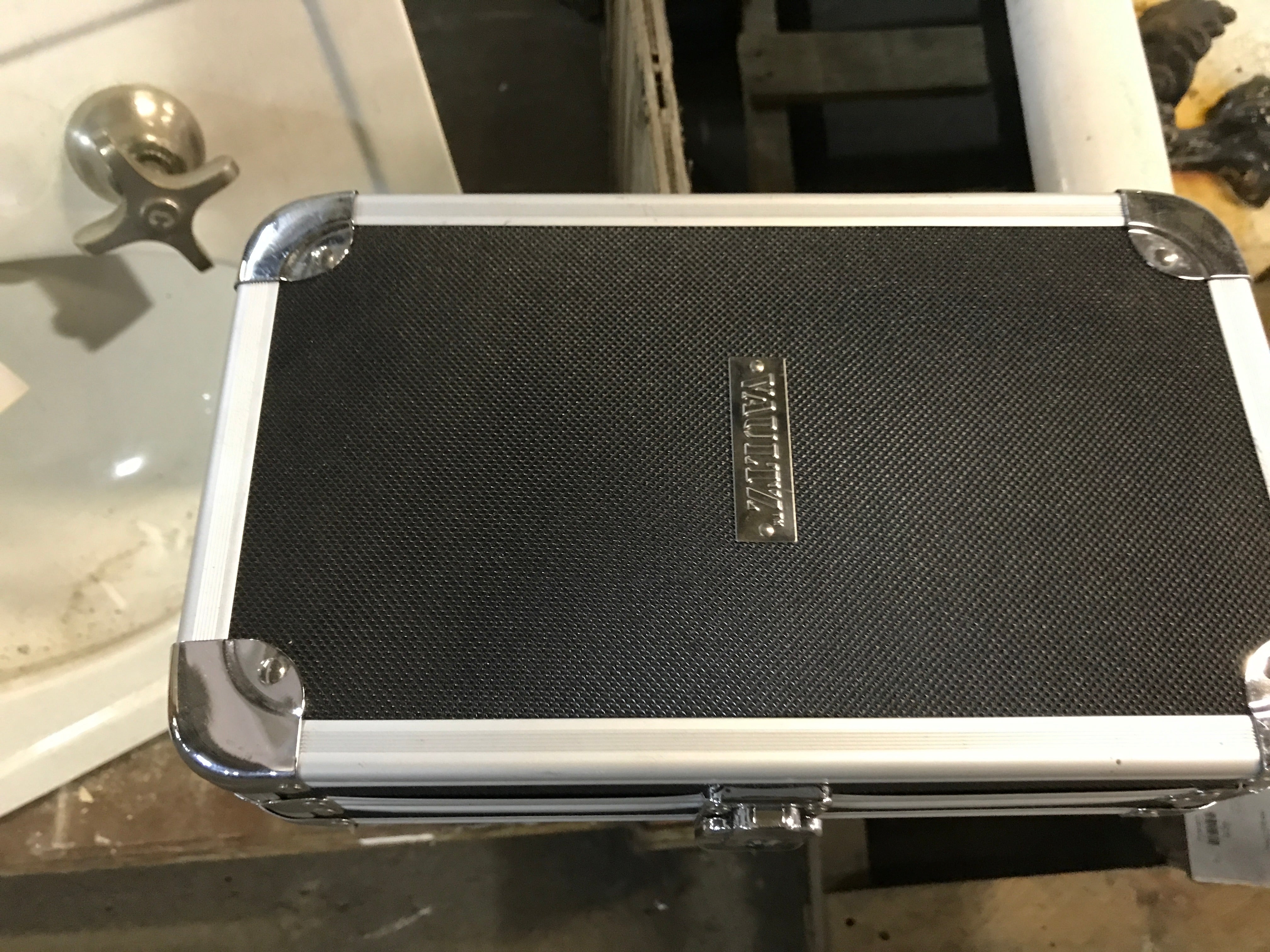 CD case with key and shoulder strap