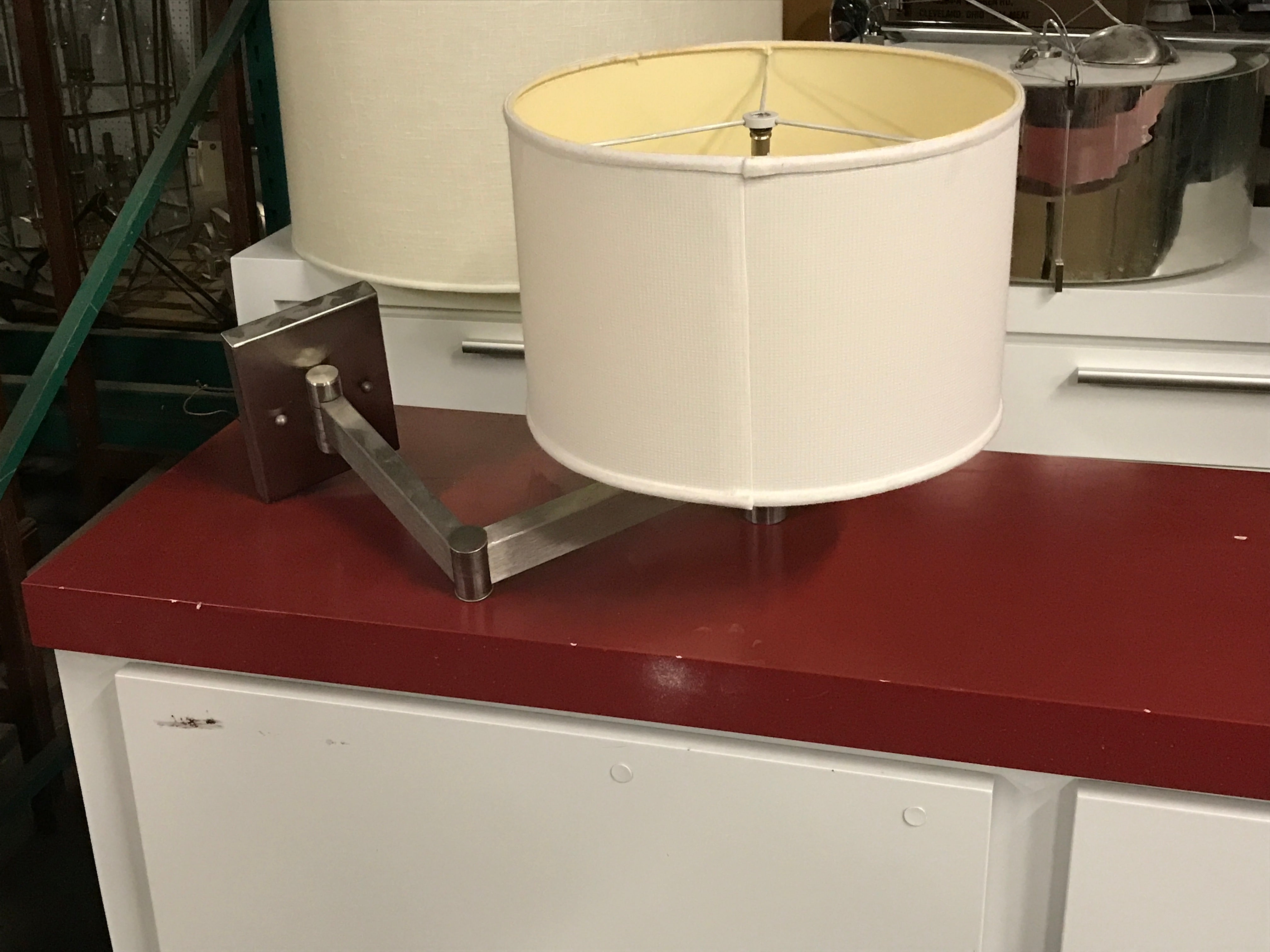 Extending arm sconce