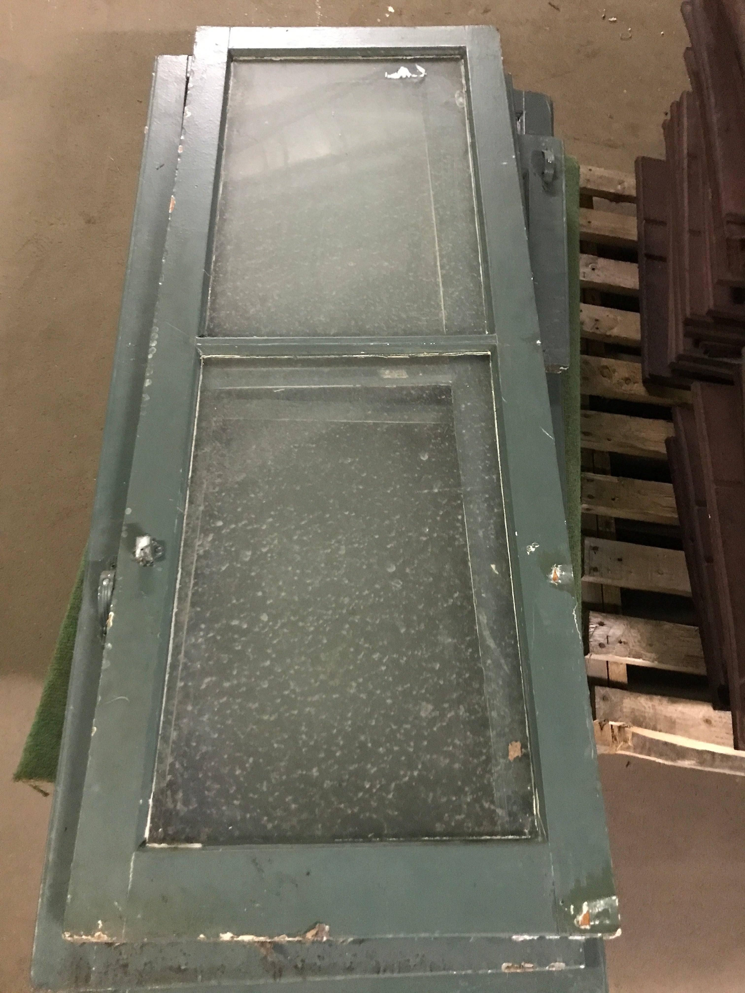 Green cabinet door with glass