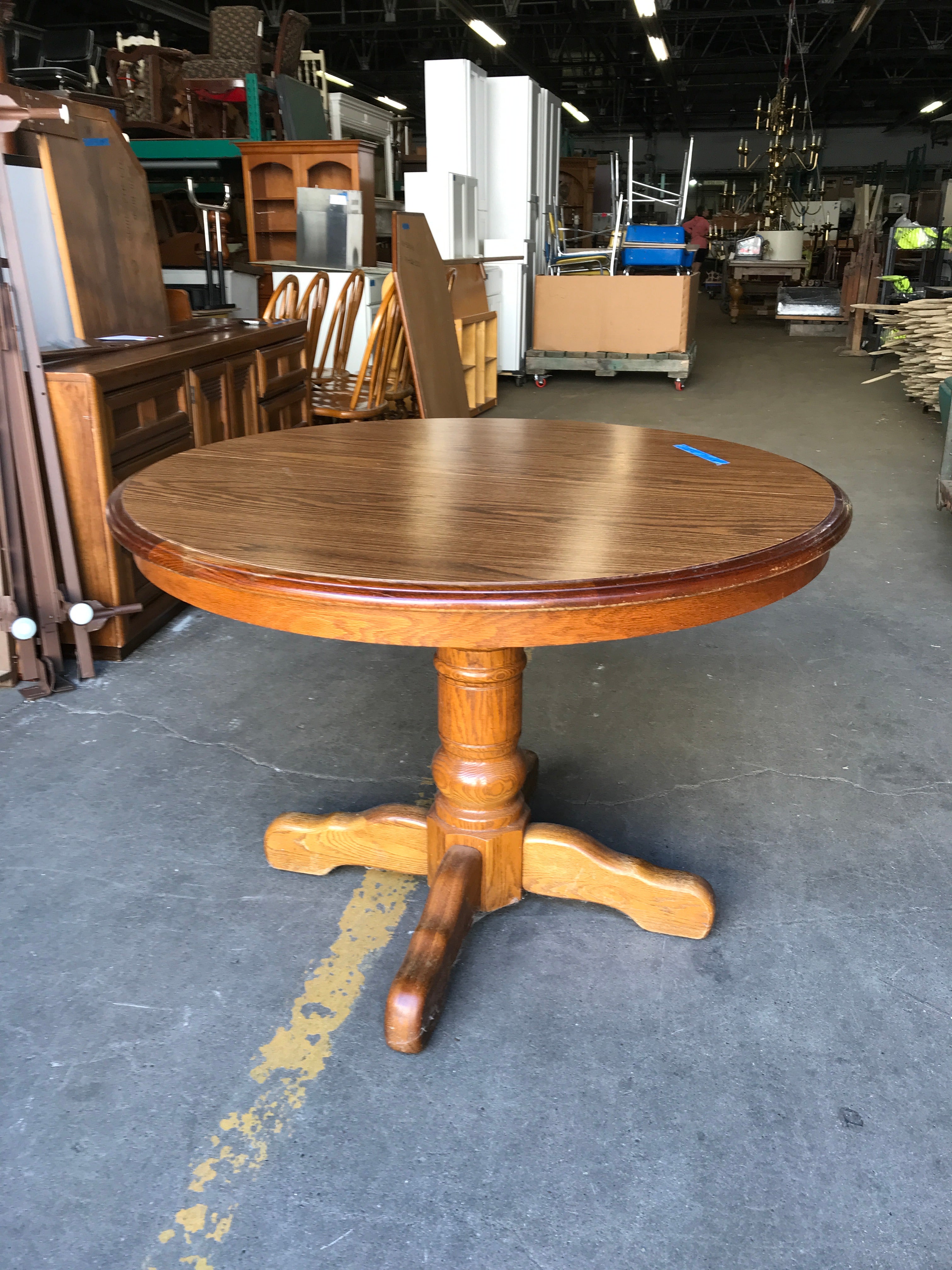 Round Oak Pedestal Dining Table with six chairs, two leaves