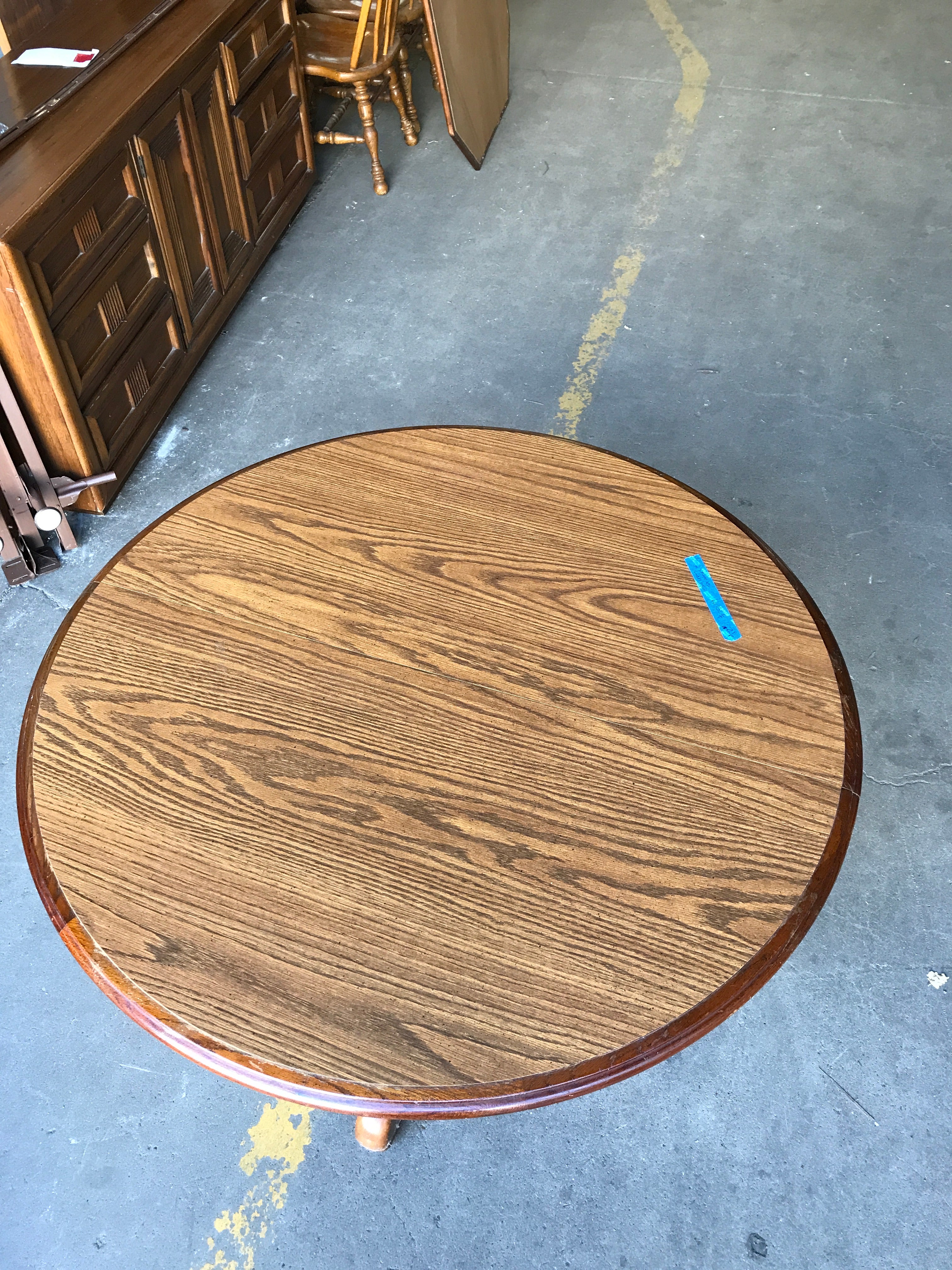 Round Oak Pedestal Dining Table with six chairs, two leaves