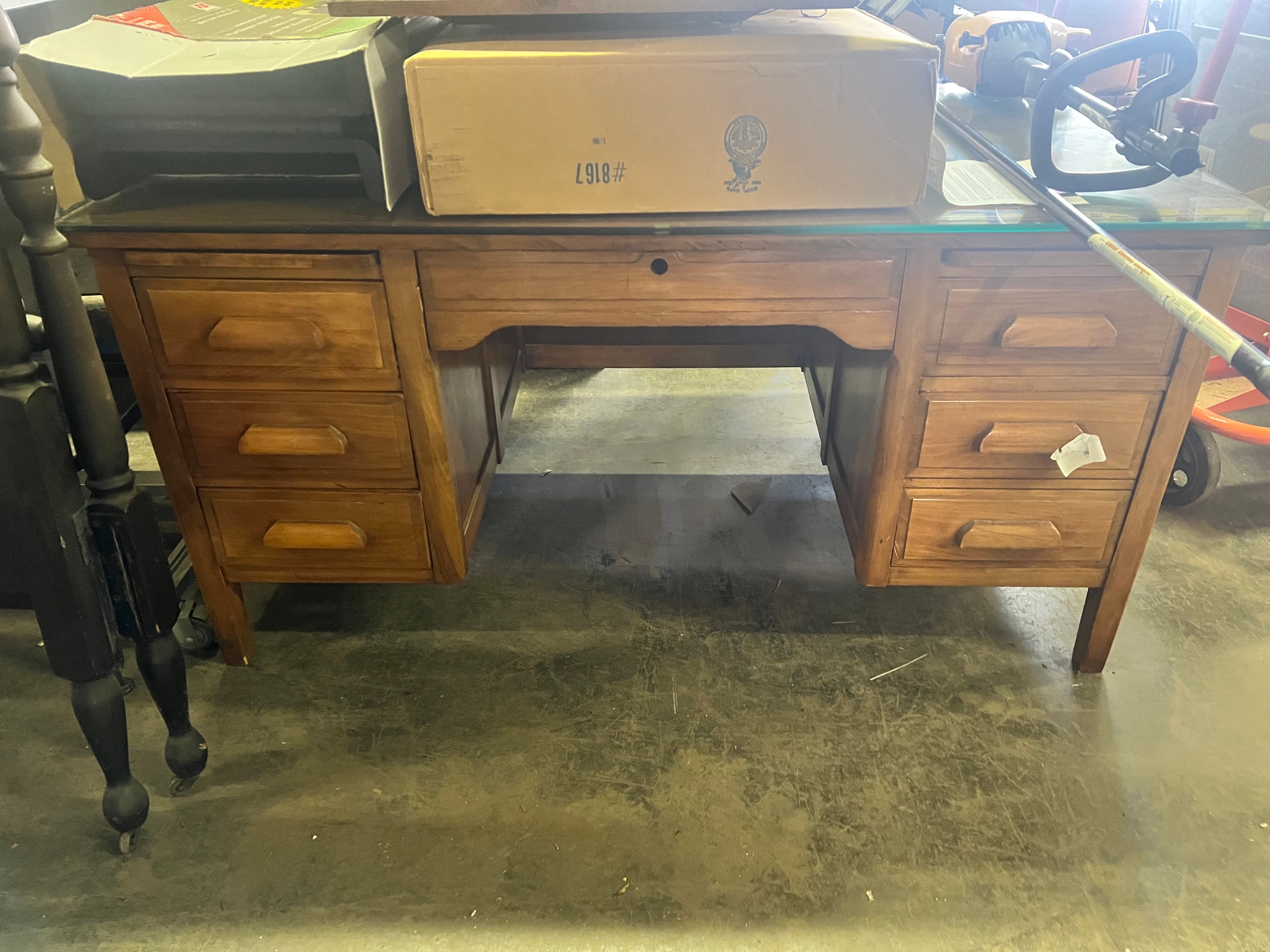 Stained wood desk with glass top