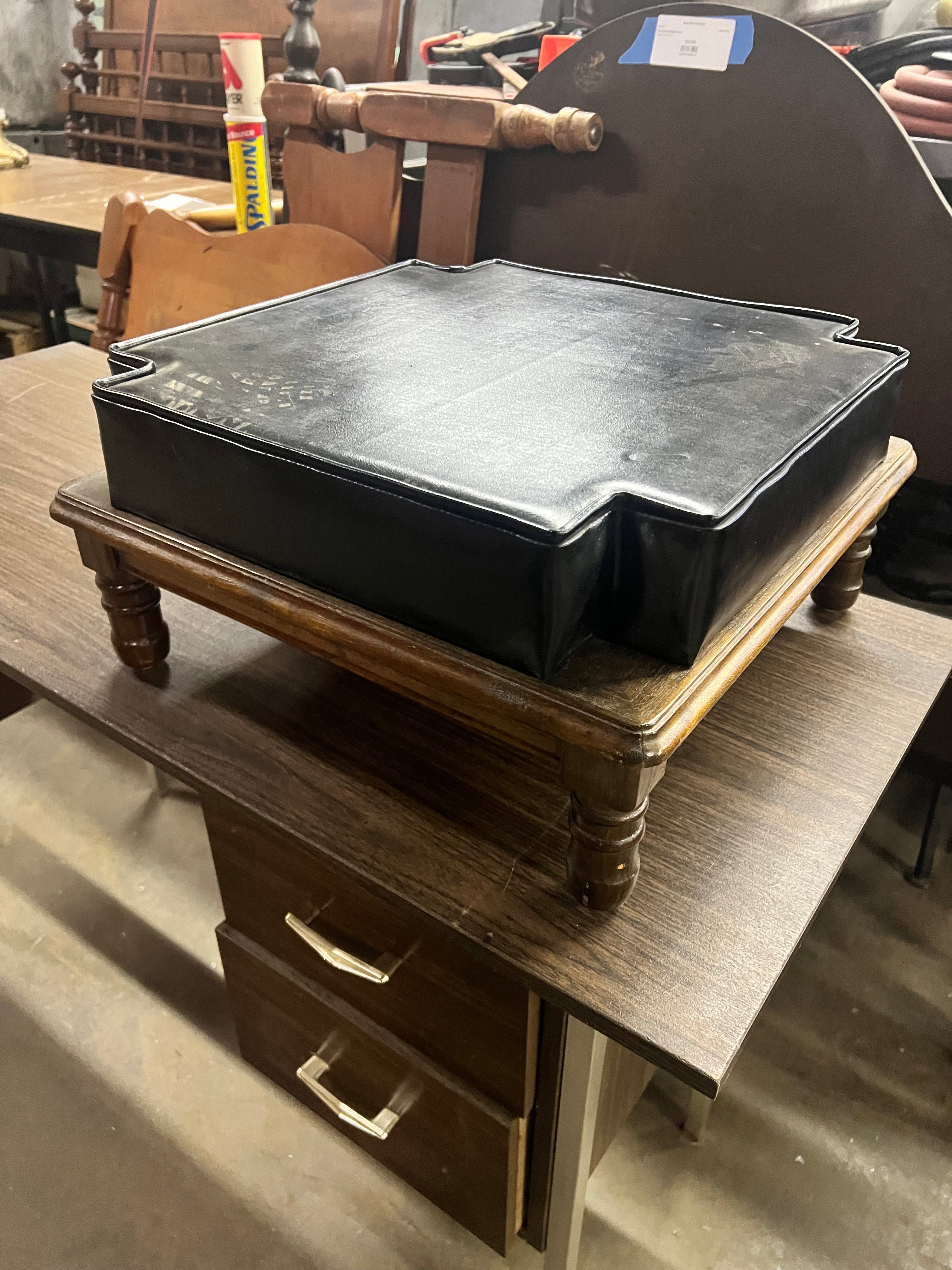 Stained footrest w leather cushion