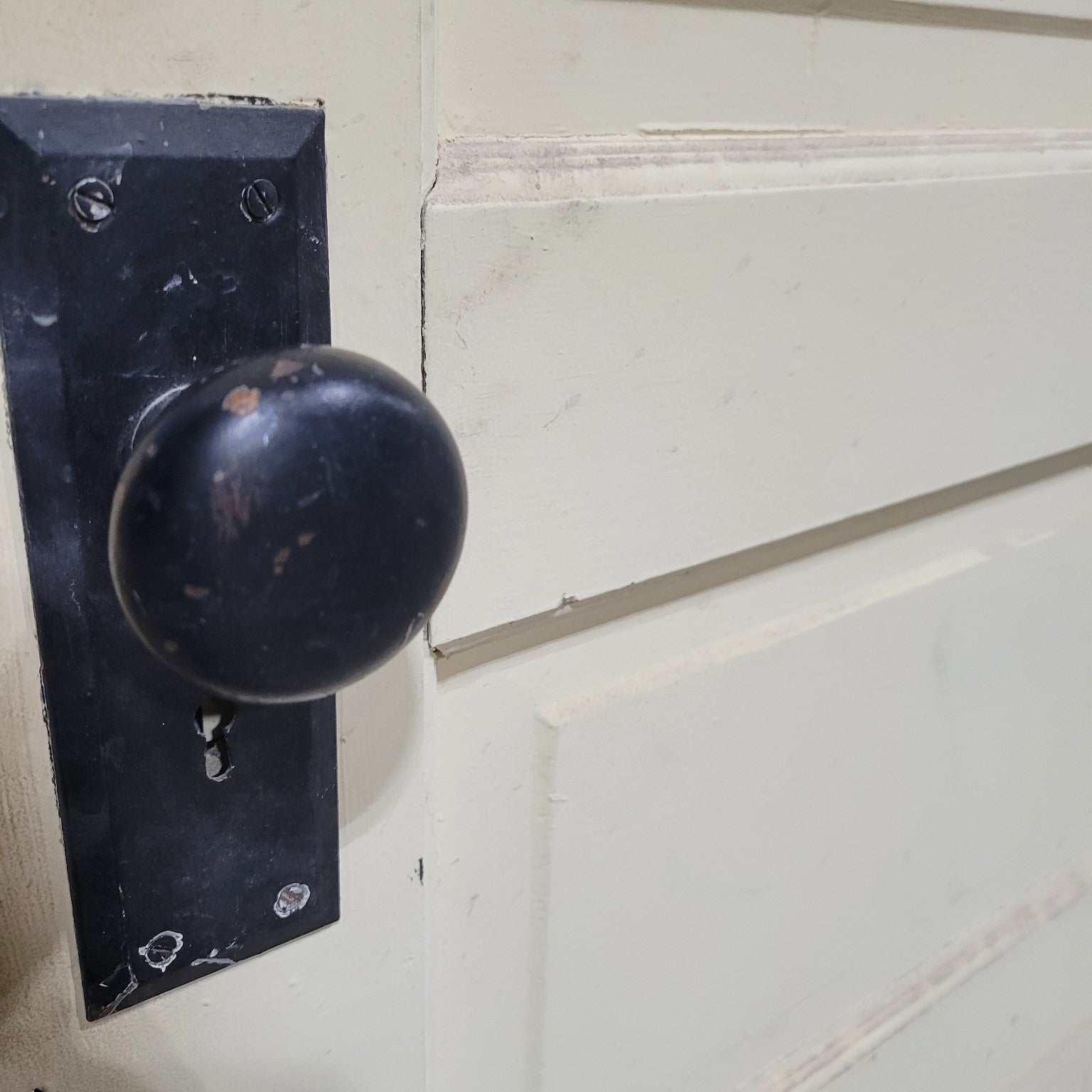 Five-Panel Wooden Door with Black Hardware