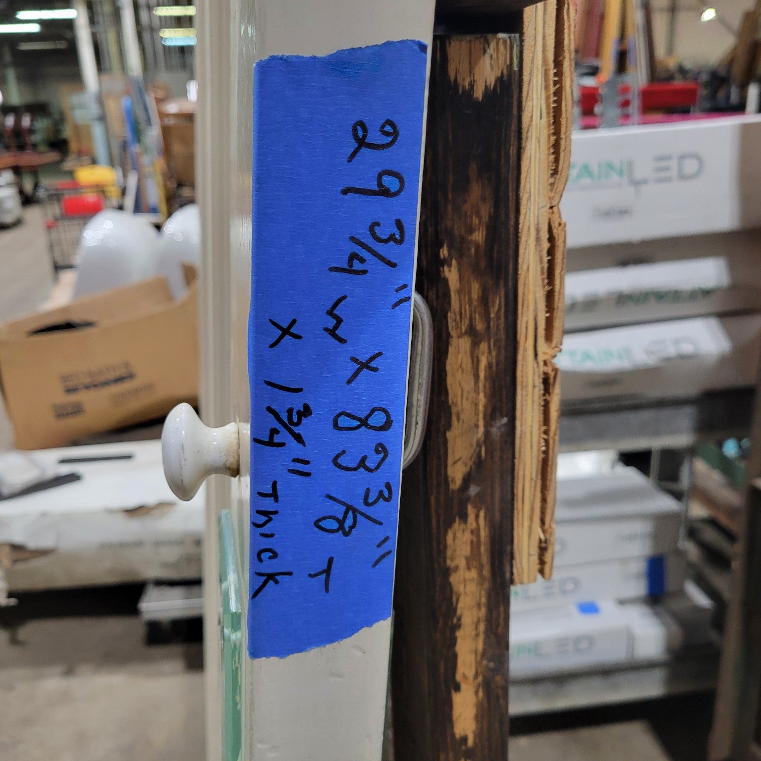 Two-Panel Wooden Swing Door with Porcelain Knob