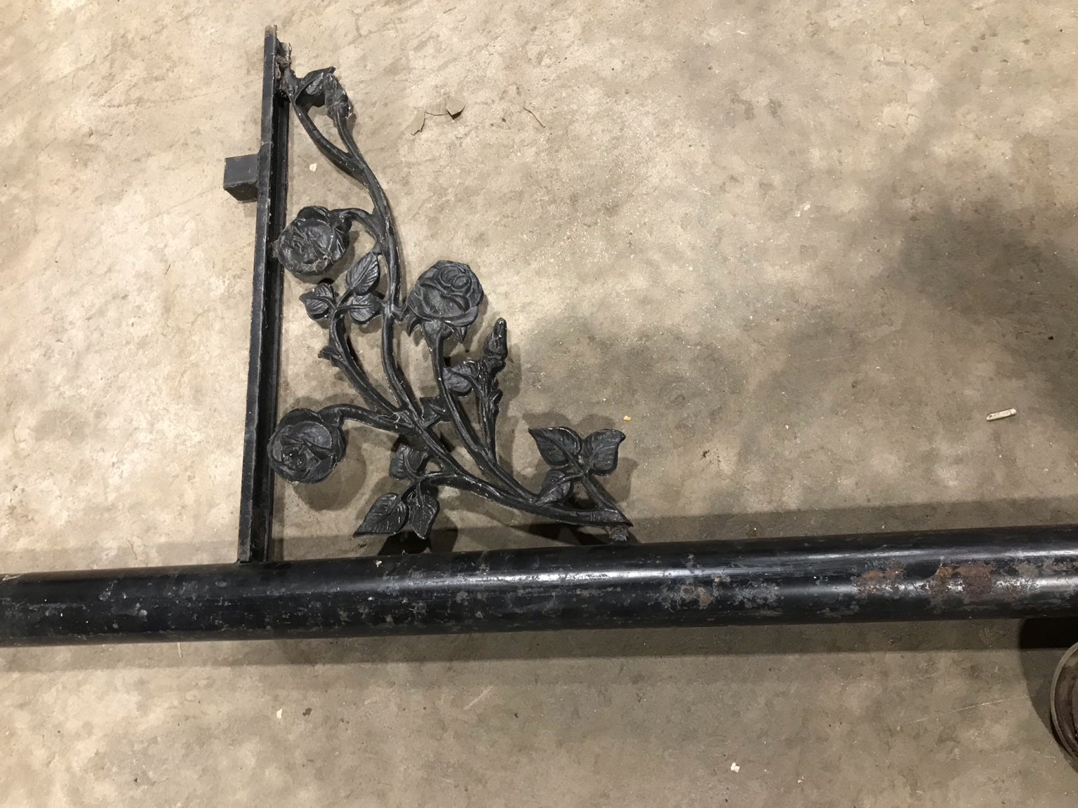 Ornate Iron Pole with Floral Bracket Accent