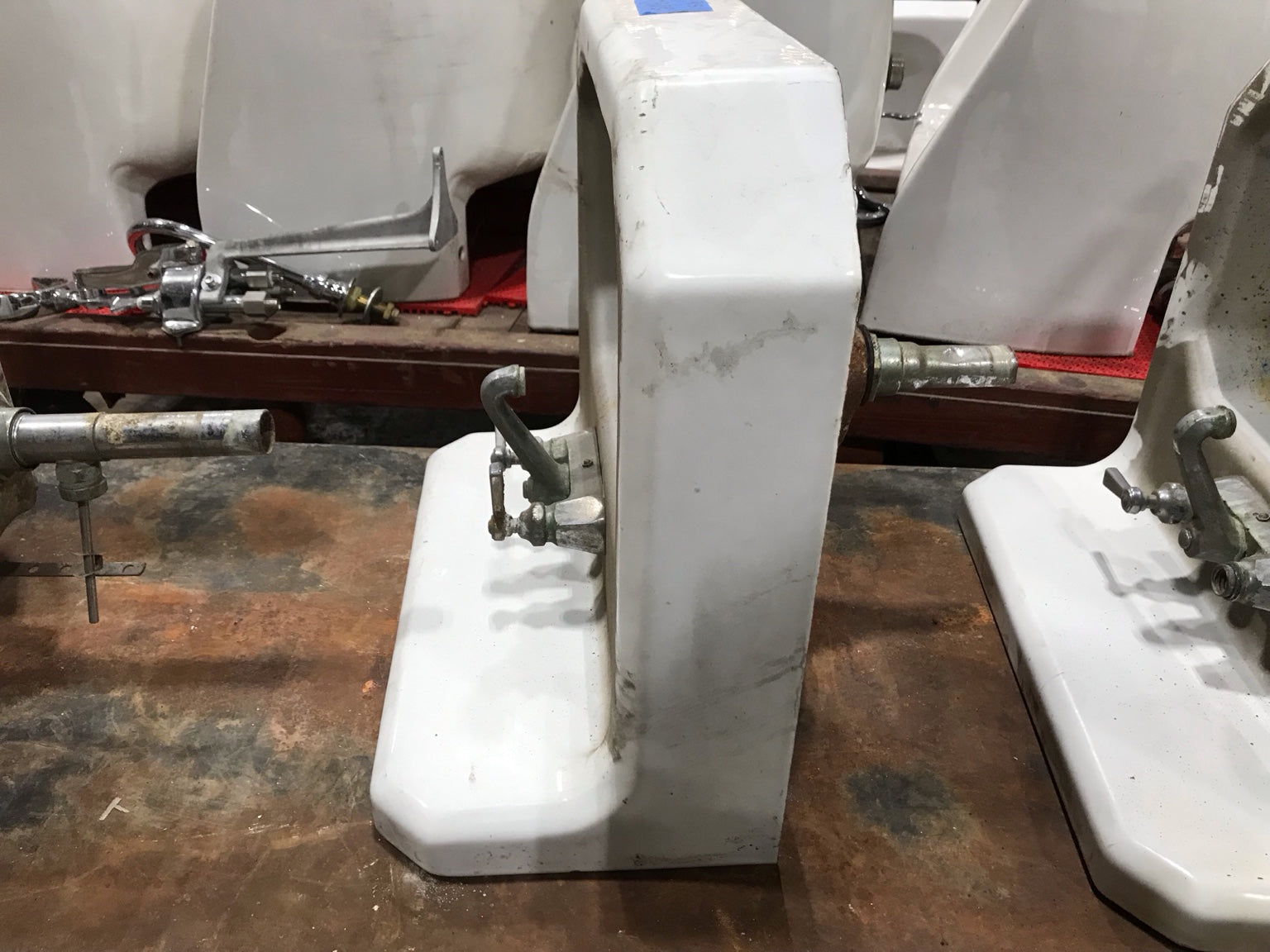 Wall-Mounted Cast Iron Sink with Dual Faucets