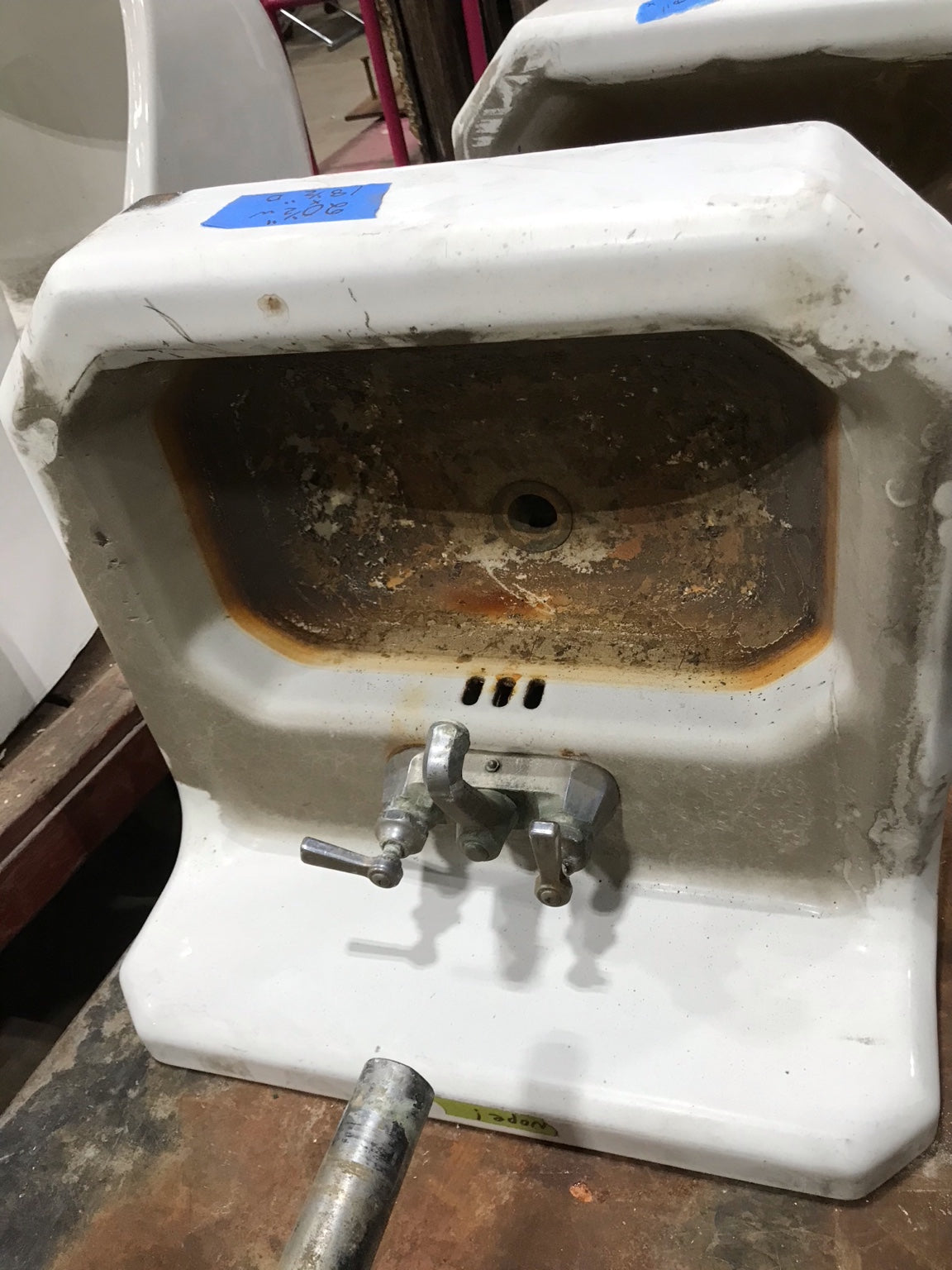 Wall-Mounted Cast Iron Sink with Dual Faucets