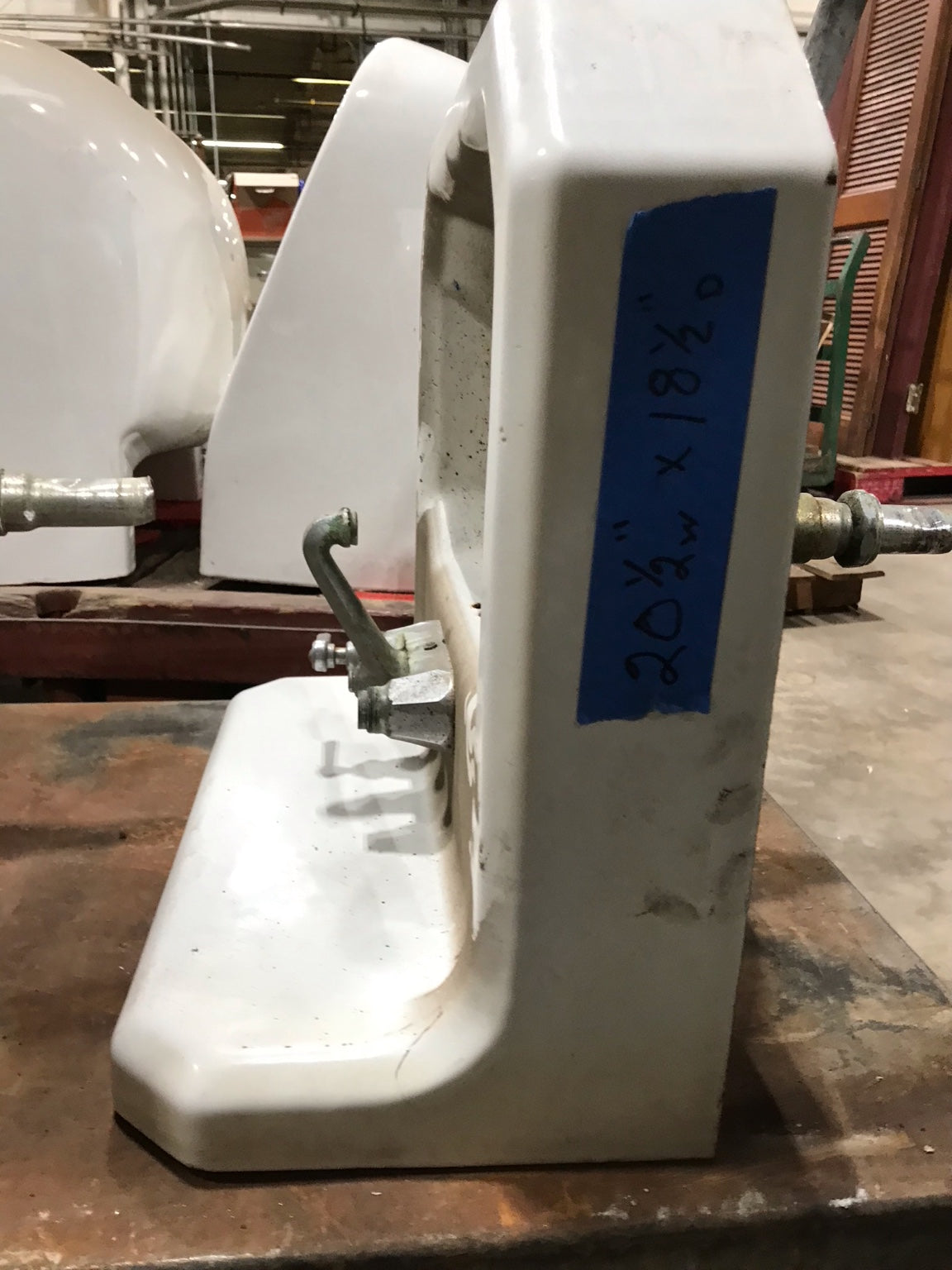 Wall-Mounted Cast Iron Sink with Dual Faucets