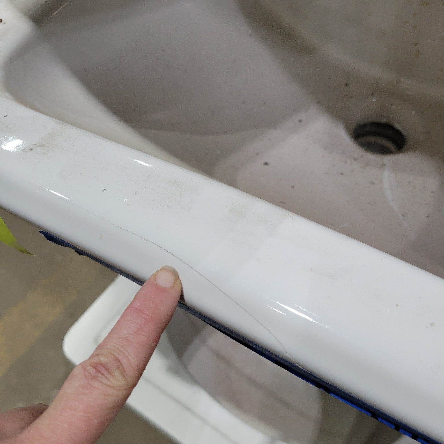 Vintage Wall-Mount Sink with Hairline Crack