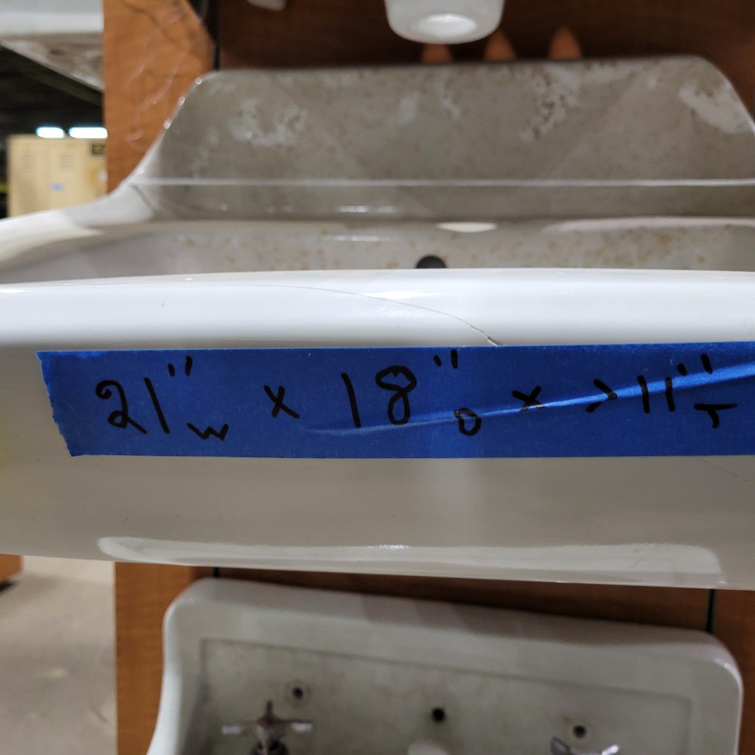 Vintage Wall-Mount Sink with Hairline Crack