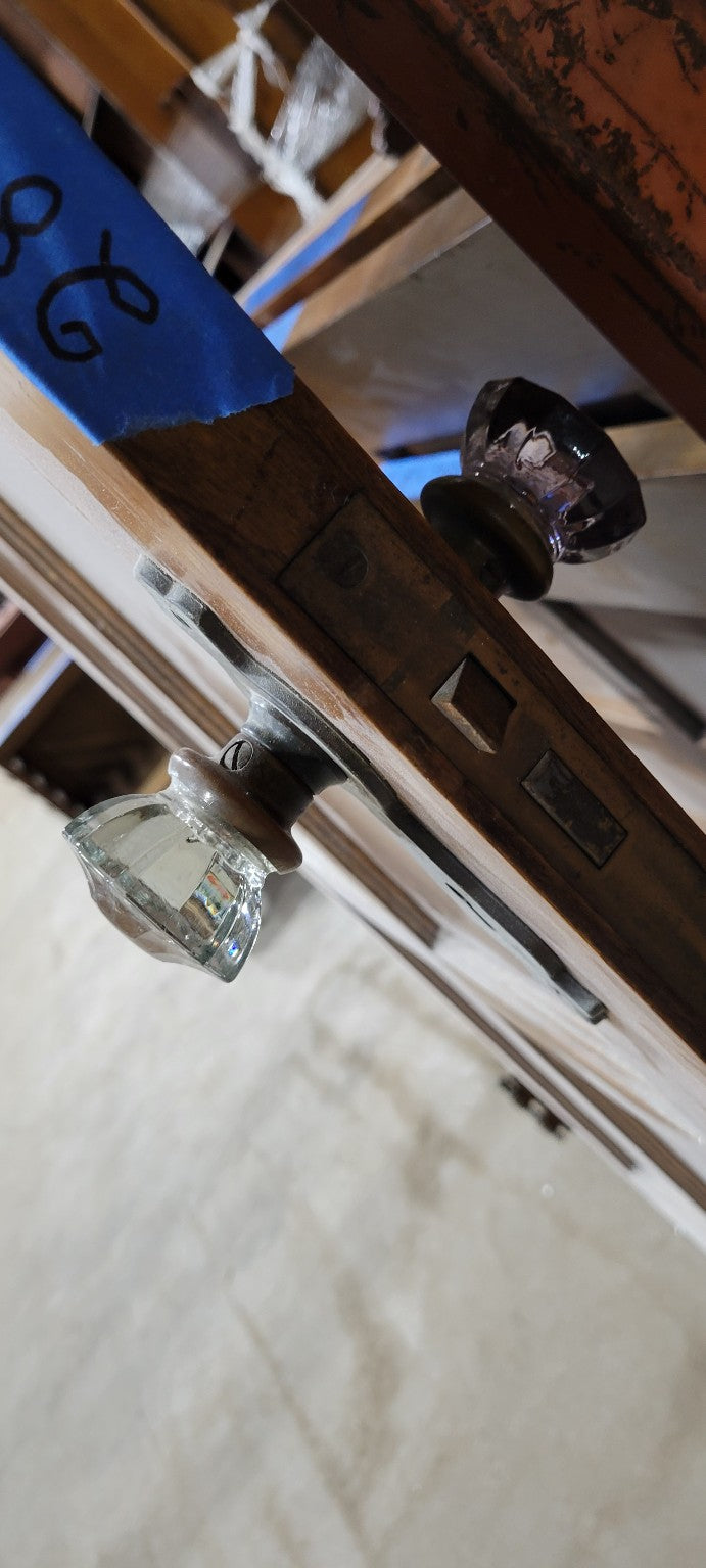 Vintage Wooden Eight-Panel Door with Glass Knob