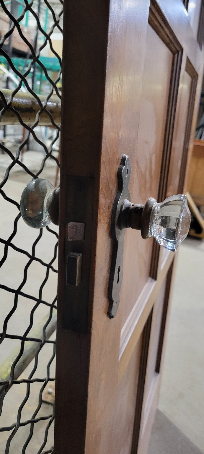 Vintage Wooden Eight-Panel Door with Glass Knob