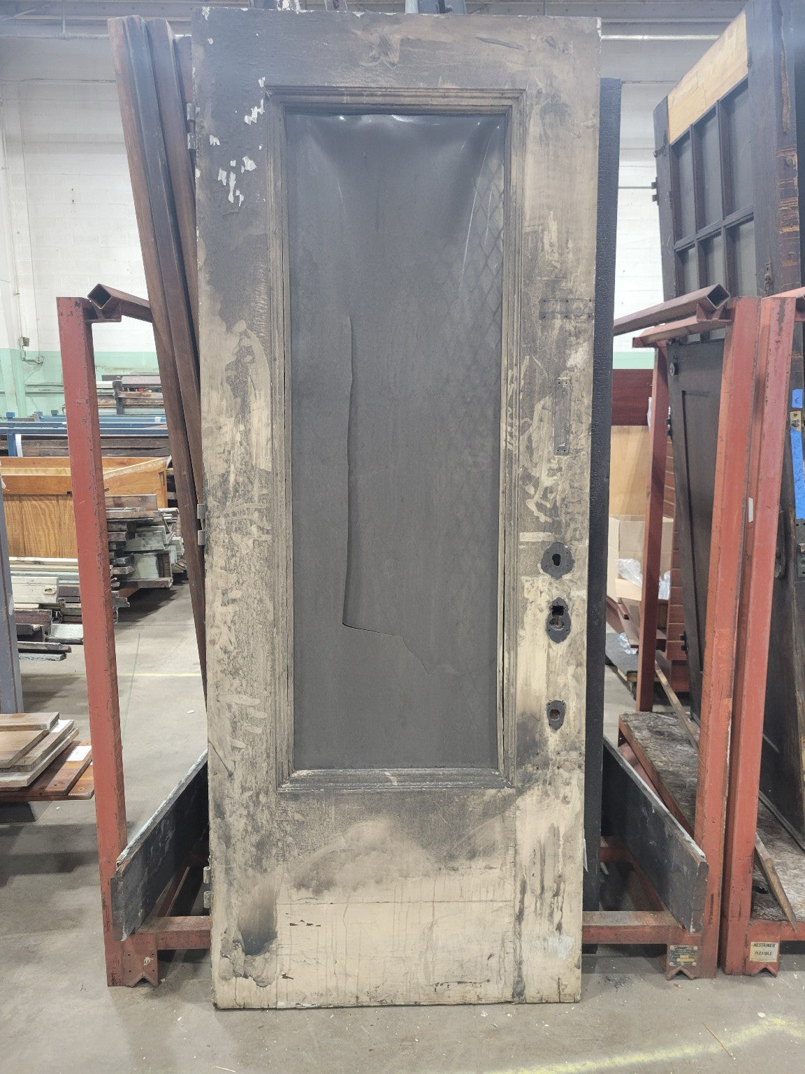 Fire-Damaged Oak Entry Door with Cracked Plexiglass Panel and Iron Hardware (Z)