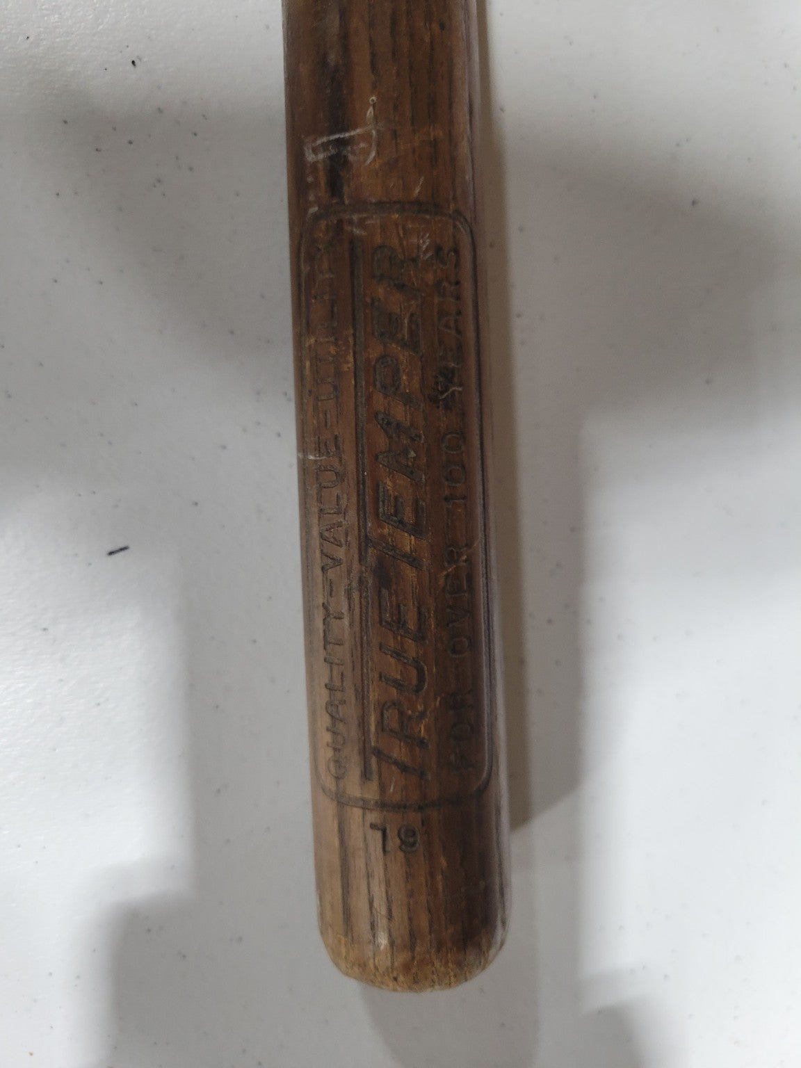 Vintage Agricultural Scythe with Curved Blade and Weathered Wooden Handle