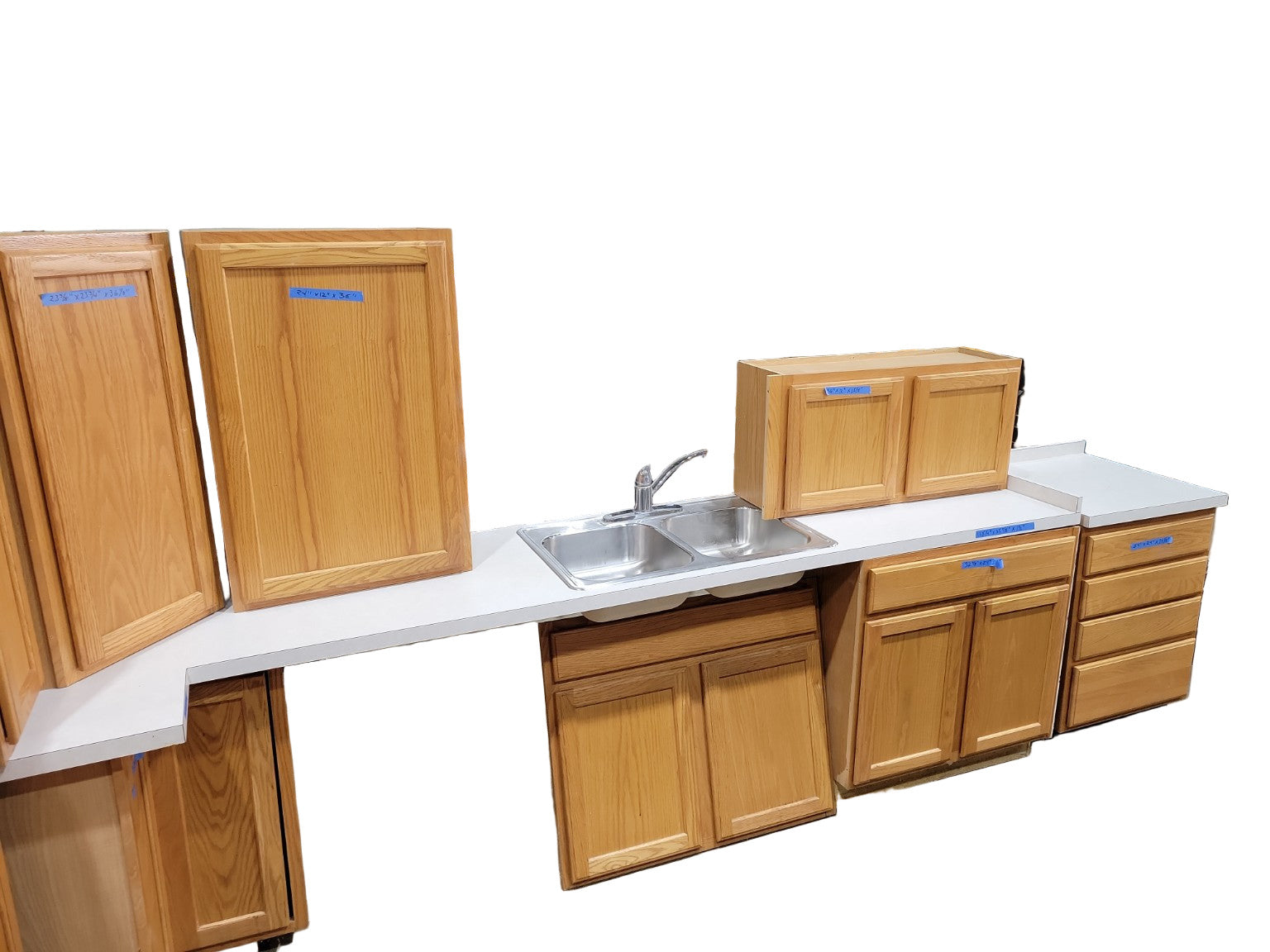Complete Honey Oak Kitchen Cabinet Set with Off-White Laminate Countertops