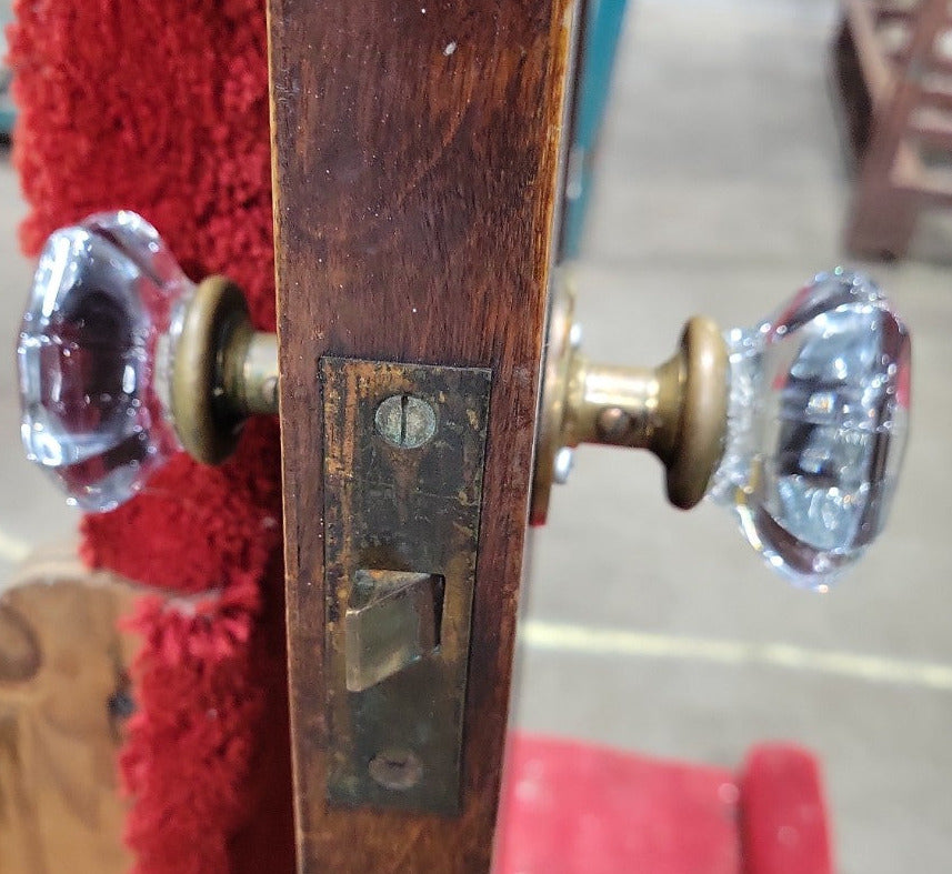 Antique Two-Panel Stained Wood Interior Door with Glass Knobs