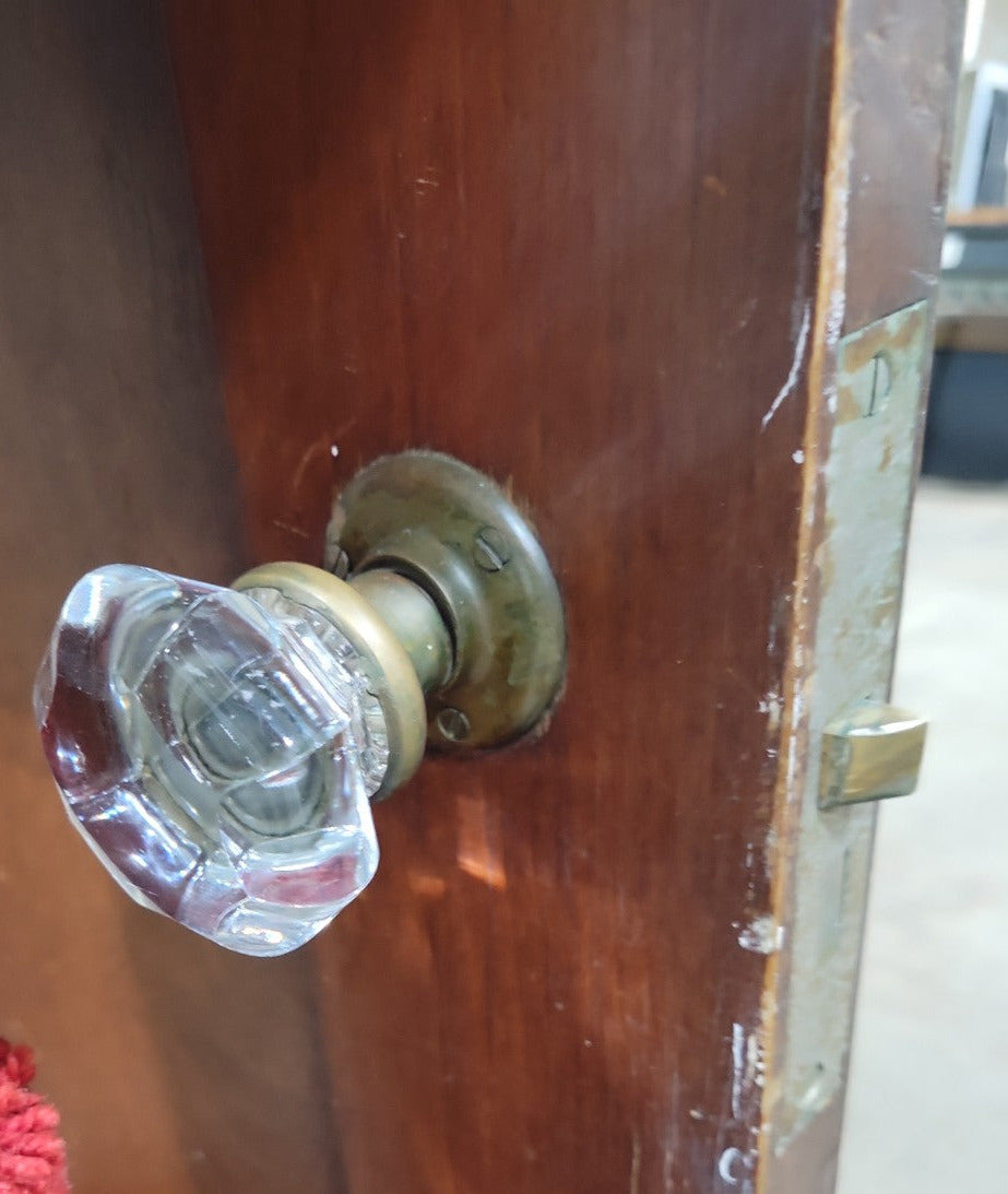 Antique Two-Panel Interior Door with Brass and Glass Knob Set