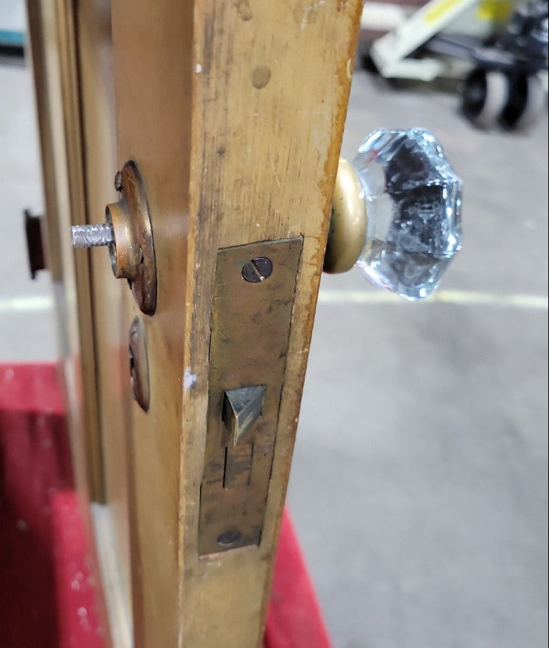 Antique Two-Panel Interior Door with Brass and Glass Knob