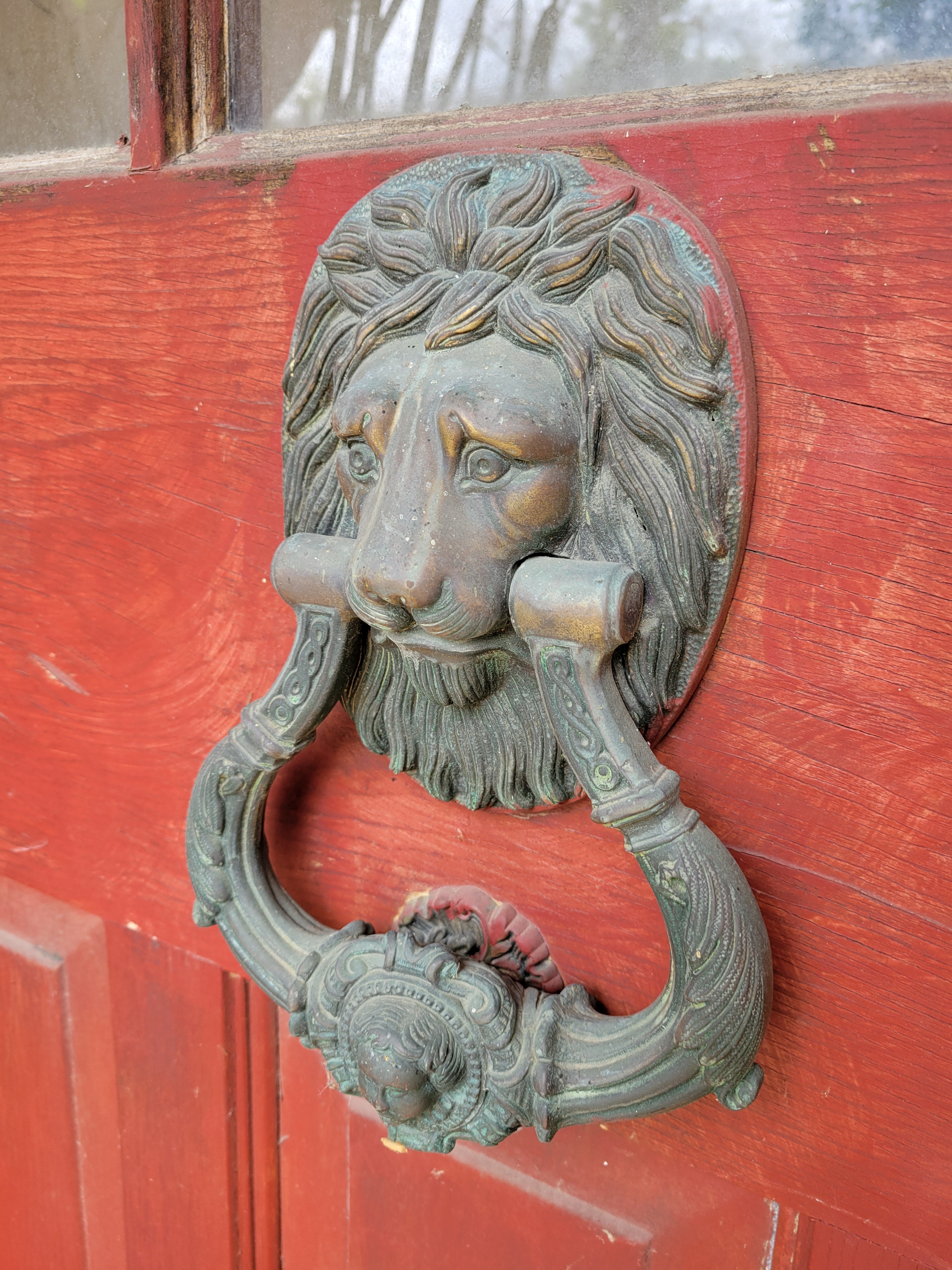 1913 Arched Top Divided Lite Entry Door with Lion Head Knocker