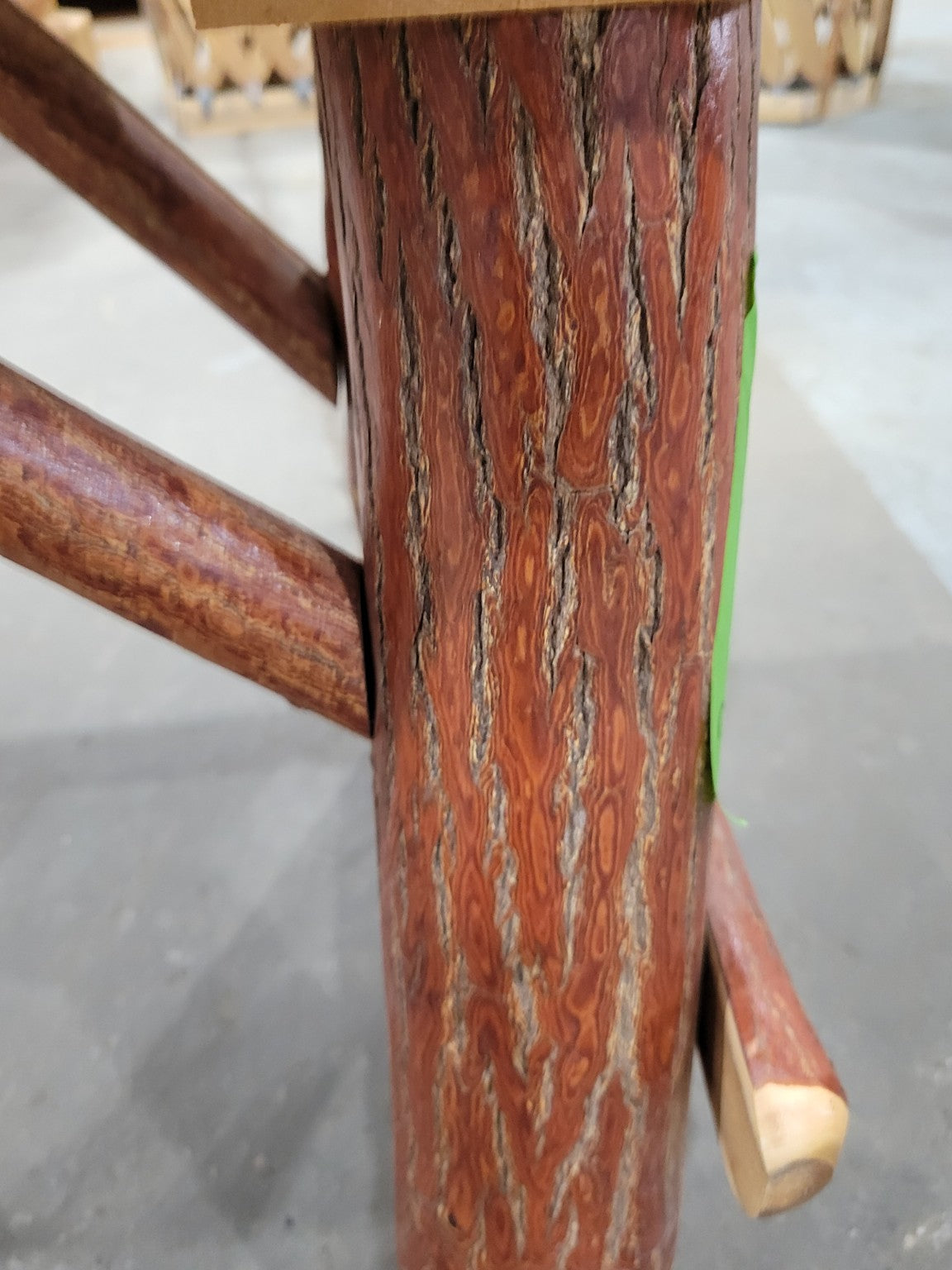 Rustic Log Bench with Bucking Horse Motif