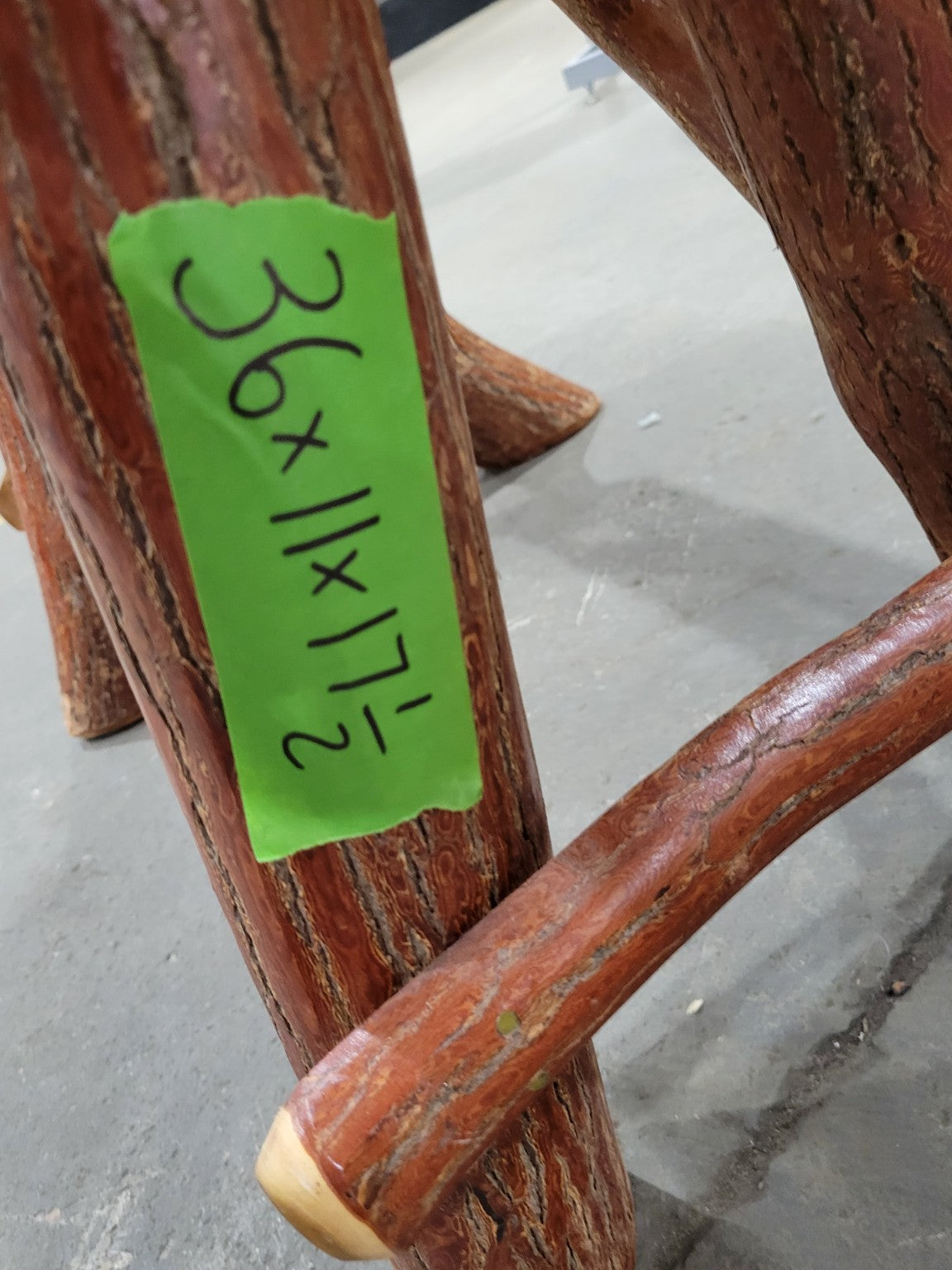 Rustic Log Bench with Bucking Horse Motif