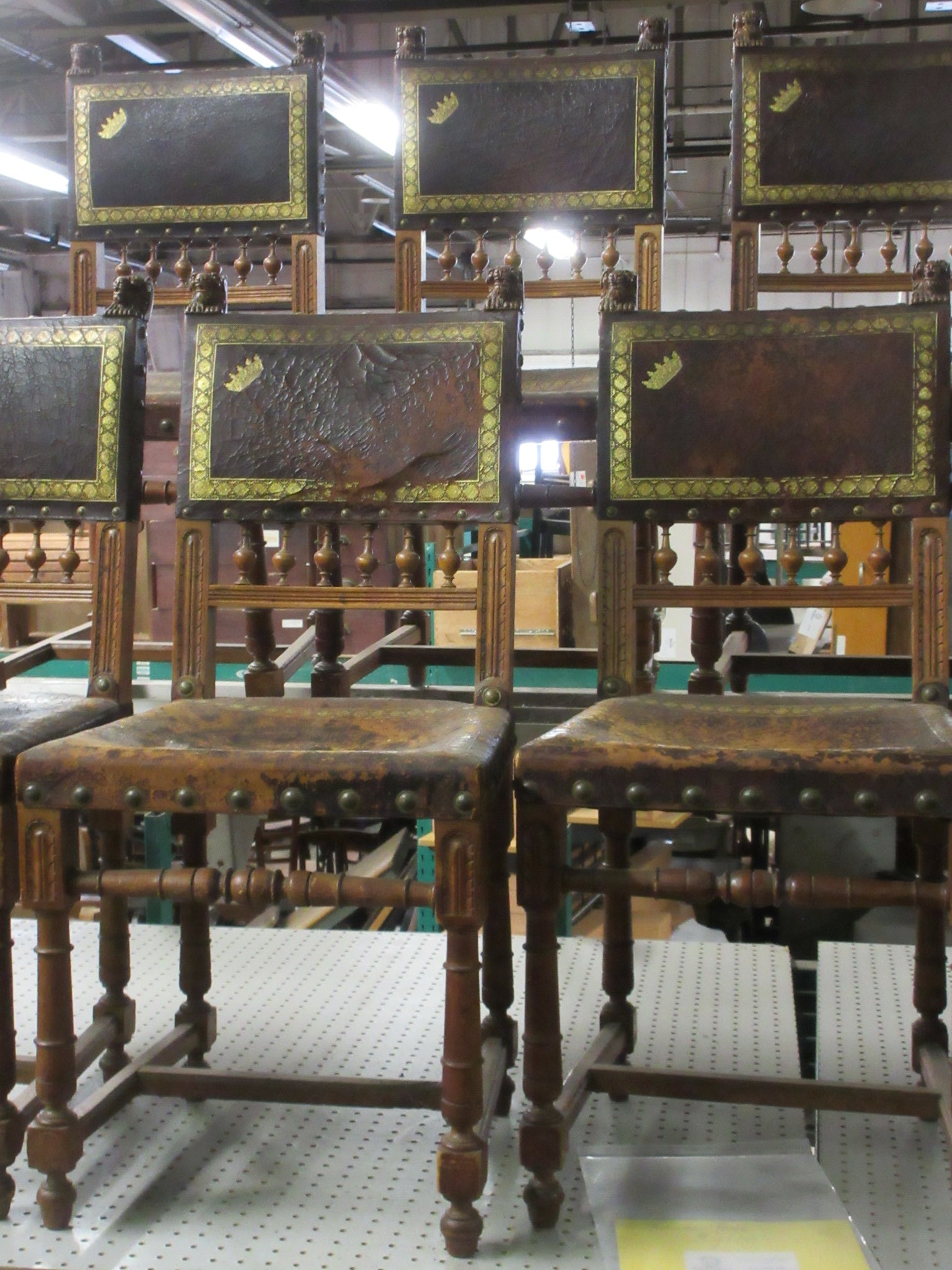 Set of 12 Antique Italian Leather Tooled Lion Head Chairs