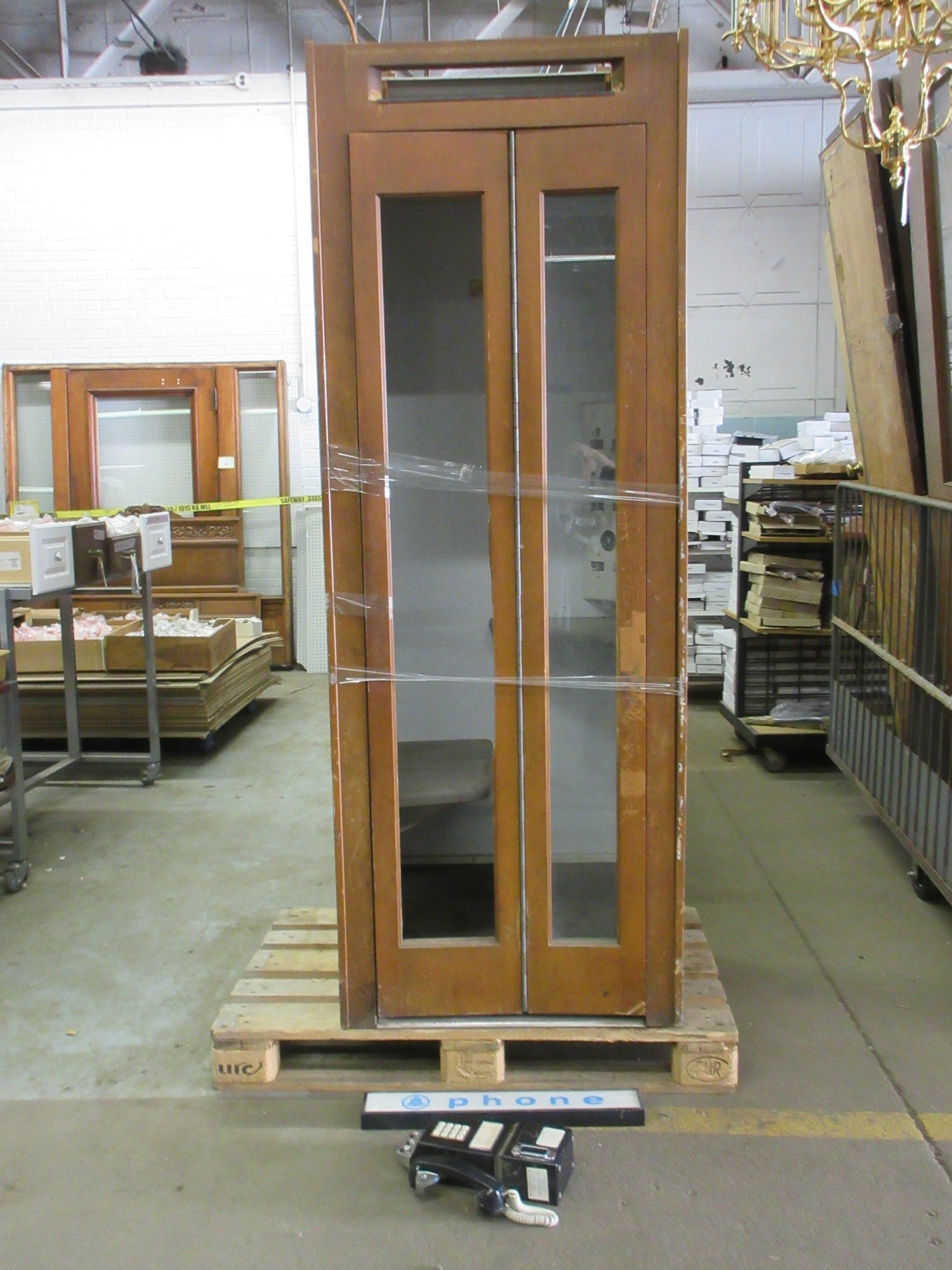 Wooden Phone Booth with Phone and Sign