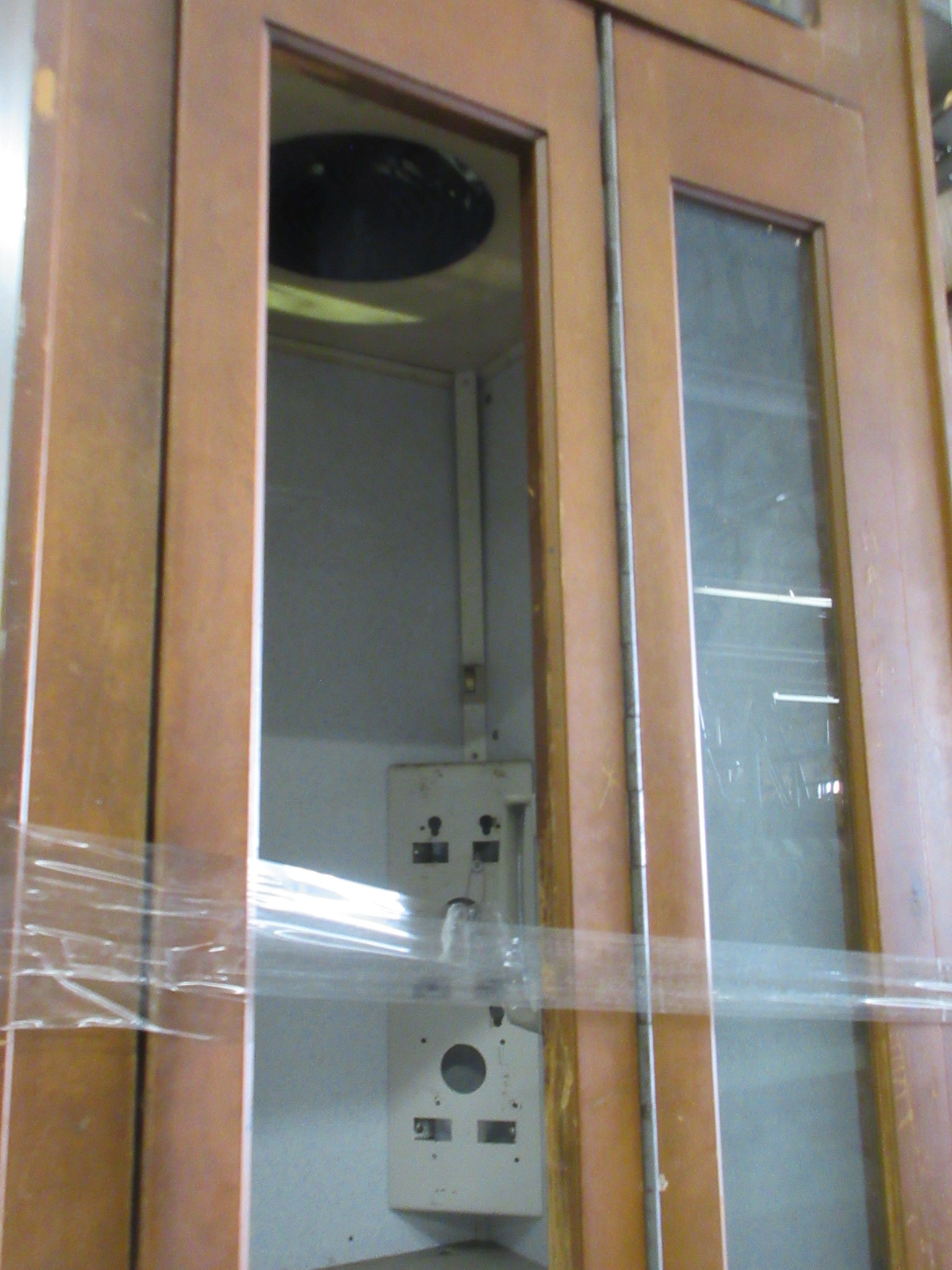 Wooden Phone Booth with Phone and Sign