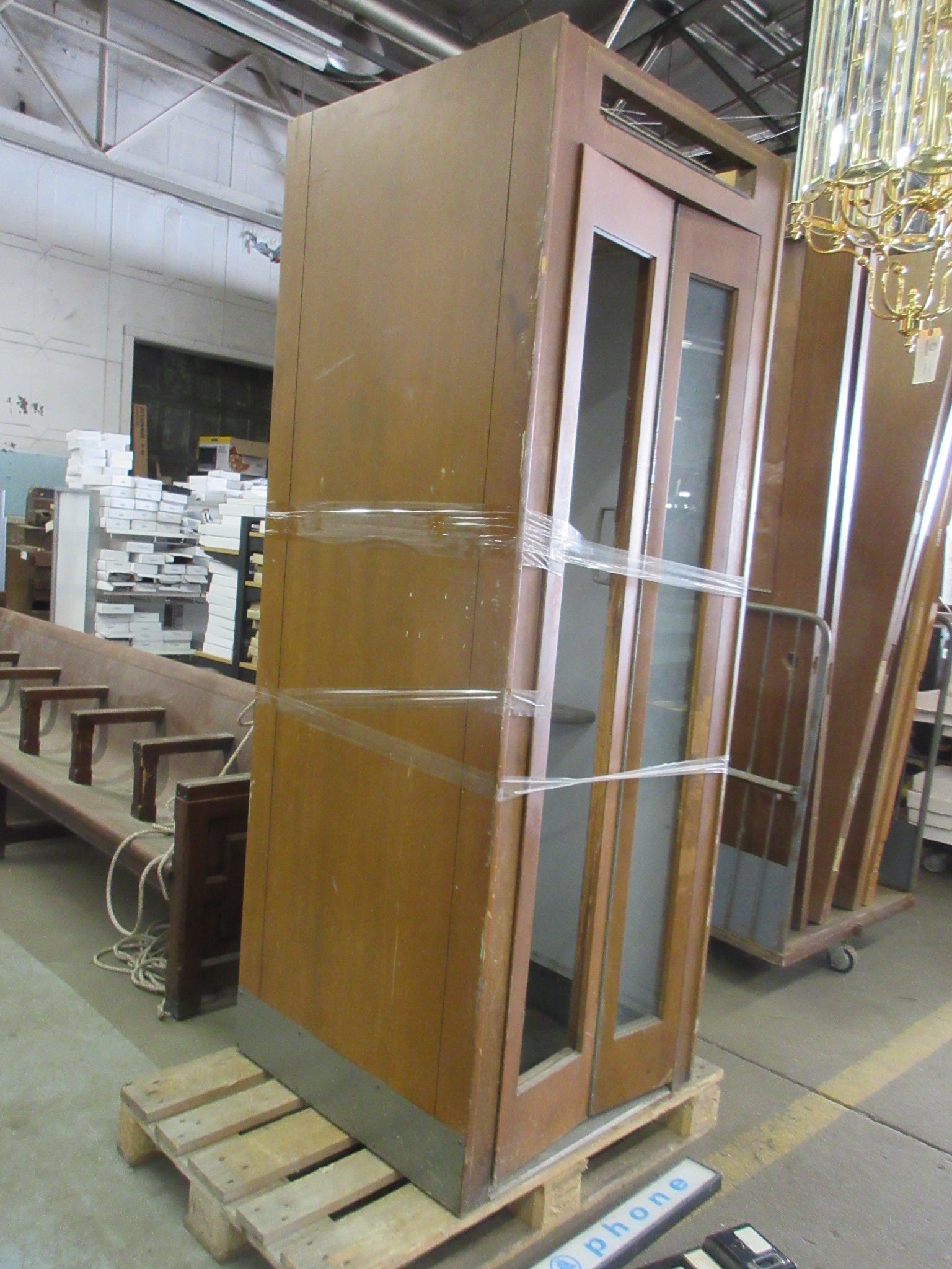 Wooden Phone Booth with Phone and Sign