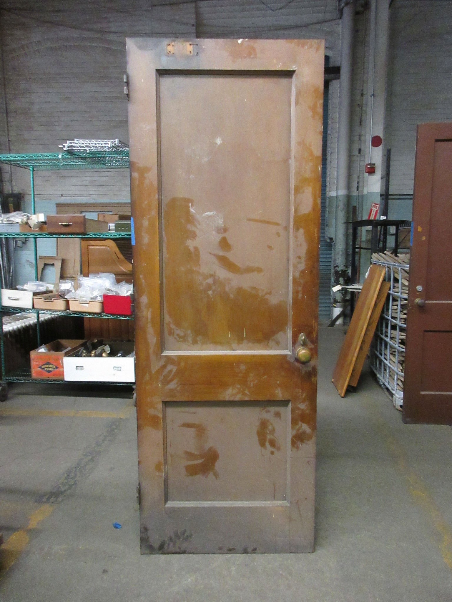 Two Panel Stained Door with Brass Hardware and Thumb Lock