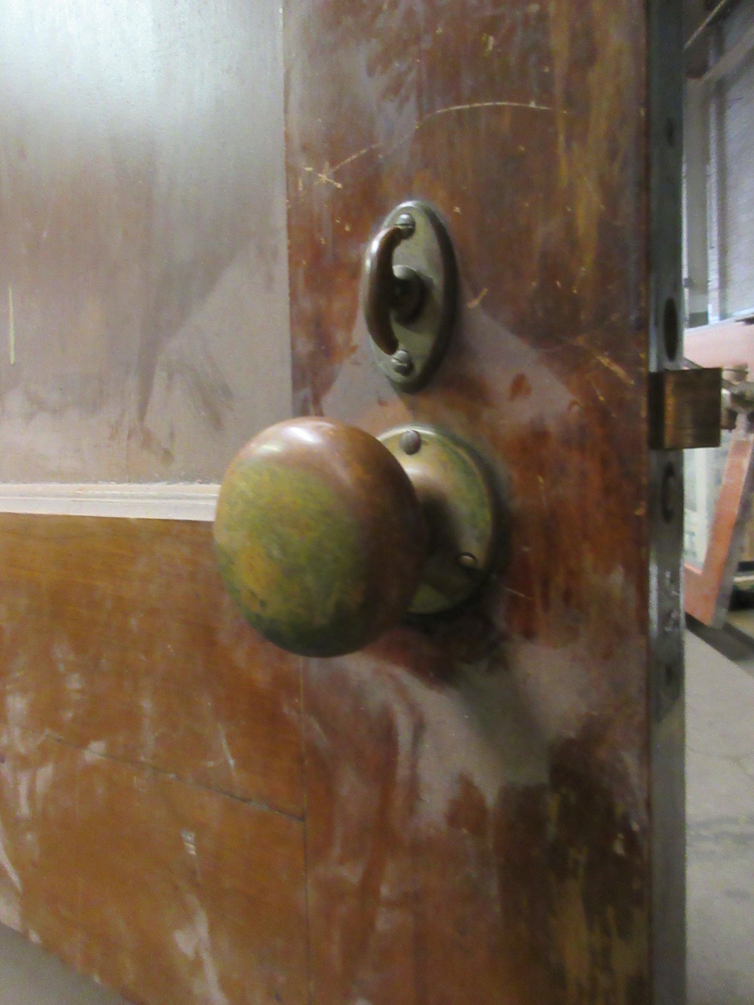 Two Panel Stained Door with Brass Hardware and Thumb Lock