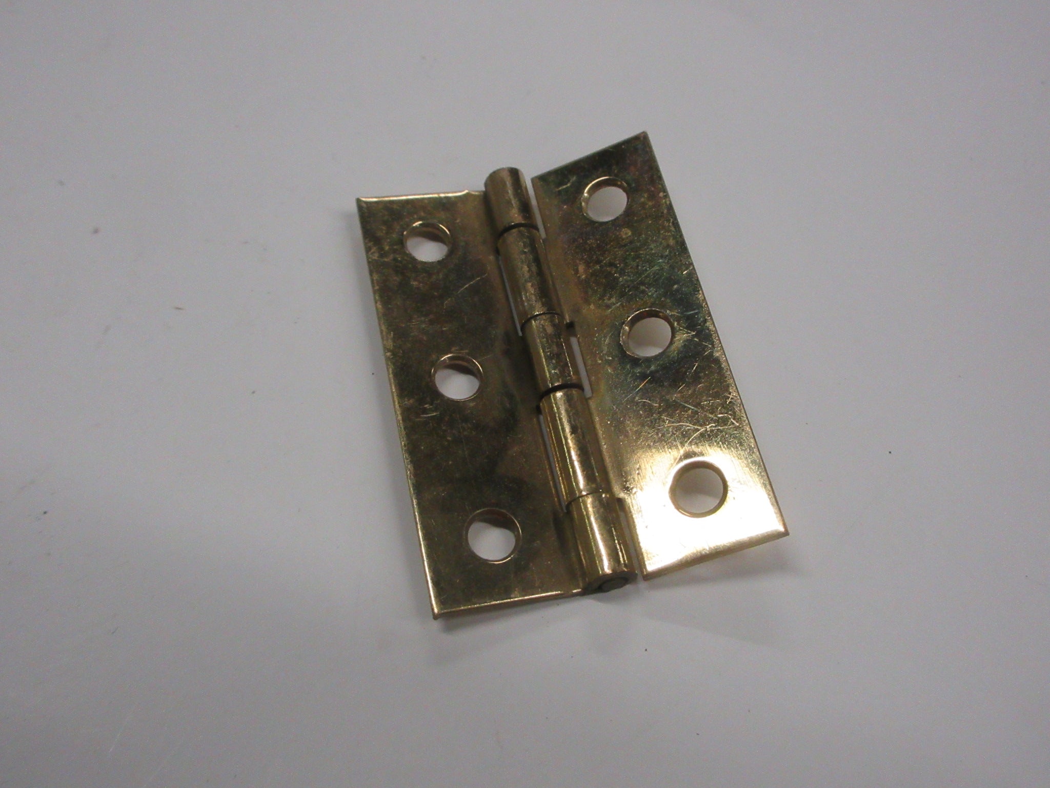 Small Brass Colored Hinge