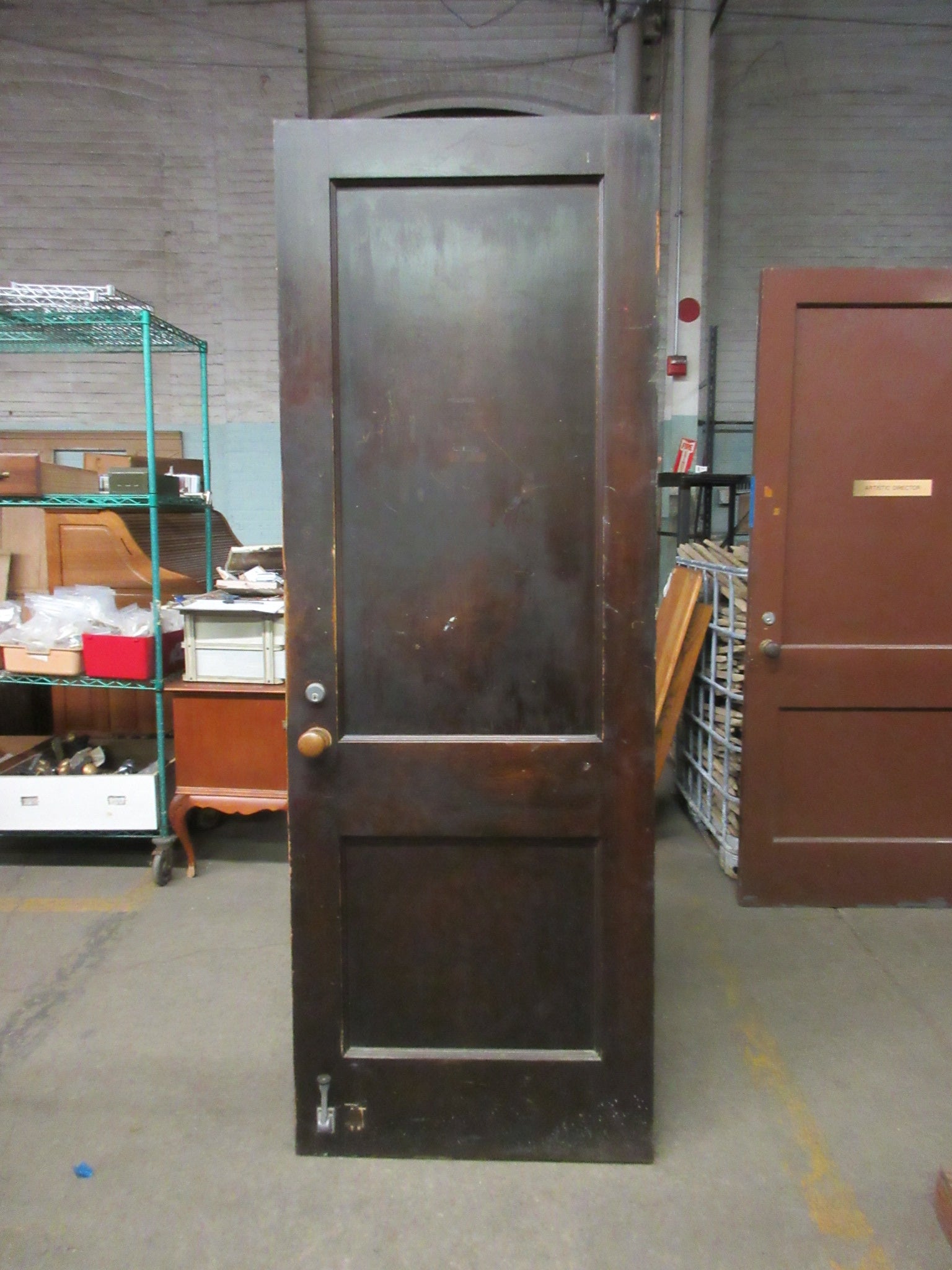 Two Panel Stained Door with Brass Hardware and Thumb Lock